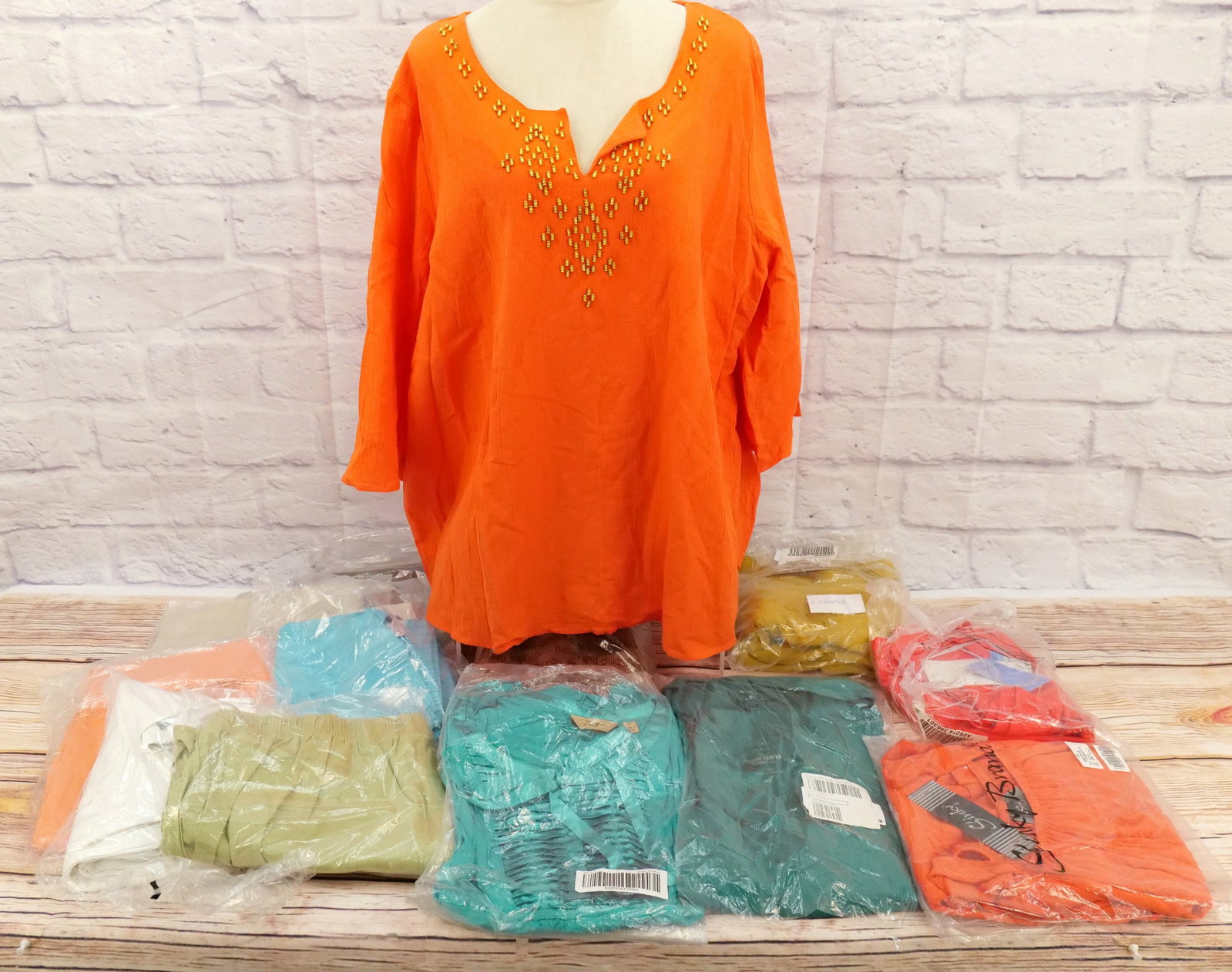 Large Lot of Ladies QVC Clothing: Large Lot of Ladies QVC Clothing including Designers such as Susan Graver, Denim & Company, Iman, Slinky Brand, Motto, and Perfect by Carson. All size 2X. Lot includes Pants, Stretch Capris, Sweater D