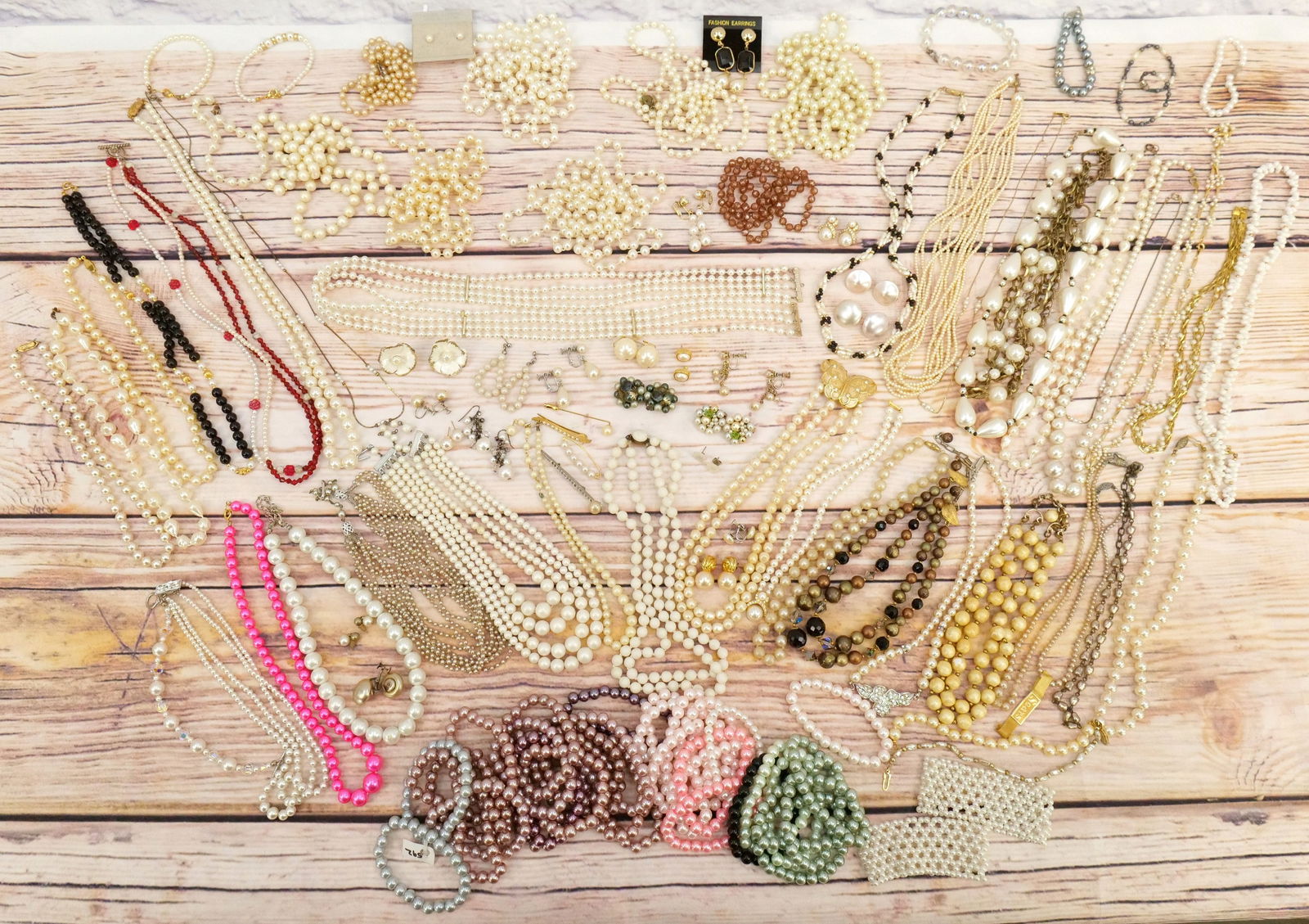 Lot of Faux Pearl, Crystal and Gold Tone Jewelry: Lot of Faux Pearl, Crystal and Gold Tone Jewelry including Gold Tone and Pearl Necklaces, Colorful Beads, Pins, Earrings and More. All invoices must be paid within 24 hours of the sale. We offer multi