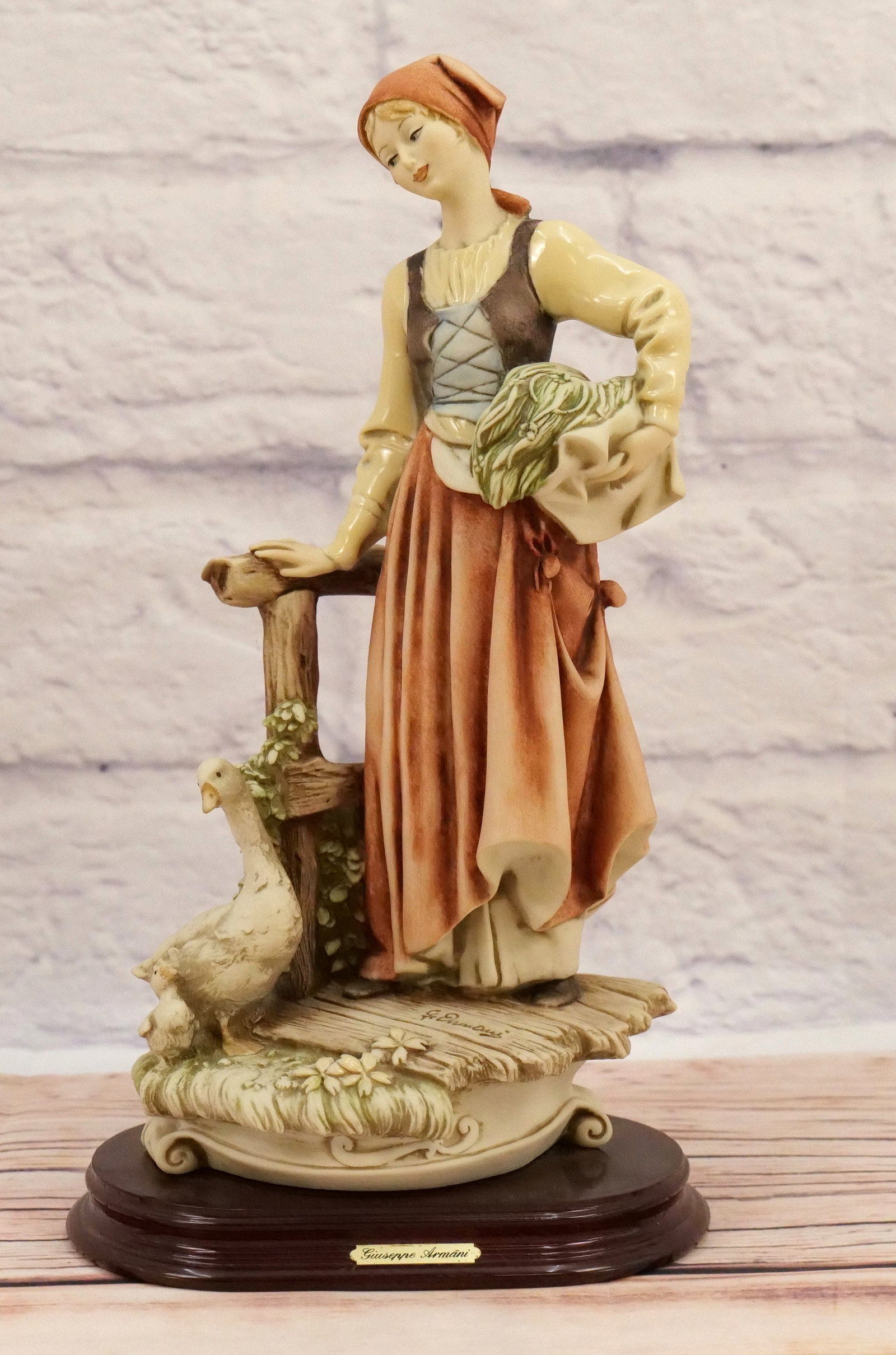 Giuseppe Armani Country Girl and Duck Figurine: Giuseppe Armani Country Girl and Duck Figurine. Art 887-C - 1992. Made in Italy. Measures 12.5" tall. All invoices must be paid within 24 hours of the sale. We offer multiple shipping options besides