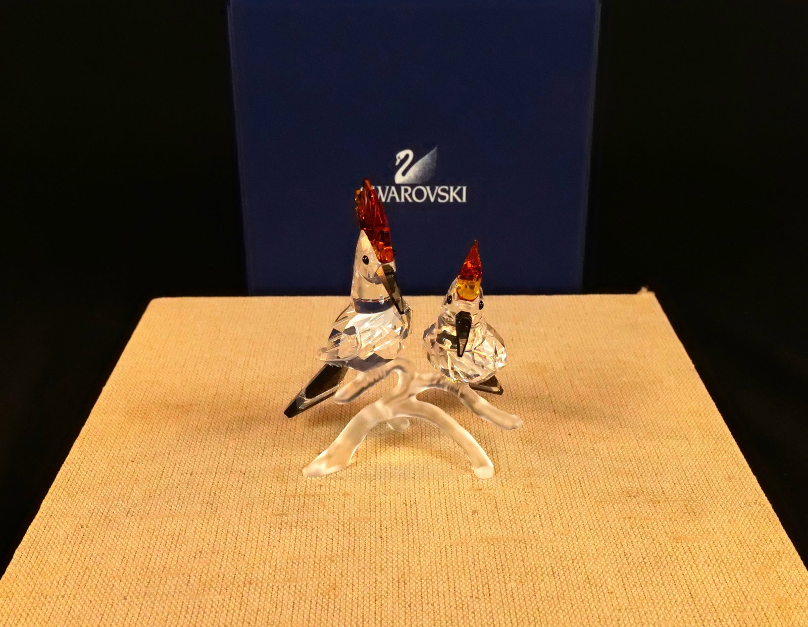 Swarovski Crystal Hoopoes Bird Figurine: Swarovski Crystal Hoopoes Bird Figurine. Item #0925080. Retired. Birds feature Black Diamond Crystal Beaks with Topaz Crowns and Jet and Clear Crystal Tails. Measures 4" tall. Comes with original box.