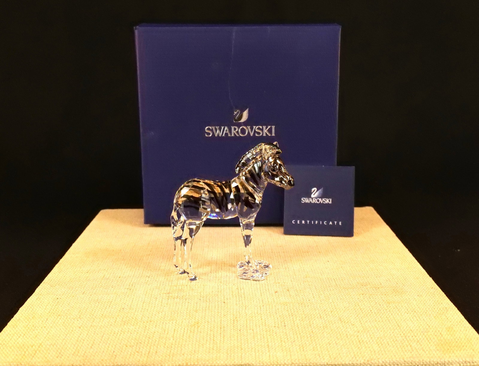 Swarovski Elegance of Africa Zebra Zuri Figurine: Swarovski Crystal Elegance of Africa Zebra Baby "Zuri" Figurine - SCS 2021. Item #5557906. Measures 3.25" tall x 3" long. Comes in original box. All invoices must be paid within 24 hours of the sale. 