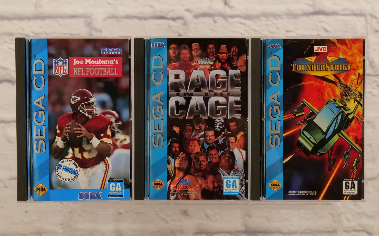 Lot of 3 Sega CD Video Games: Lot of 3 Sega CD Video Games including WWF Rage in the Cage, ThunderStrike, and Joe Montana's NFL Football. All come with the cases and instruction booklets. All invoices must be paid within 24 hours 