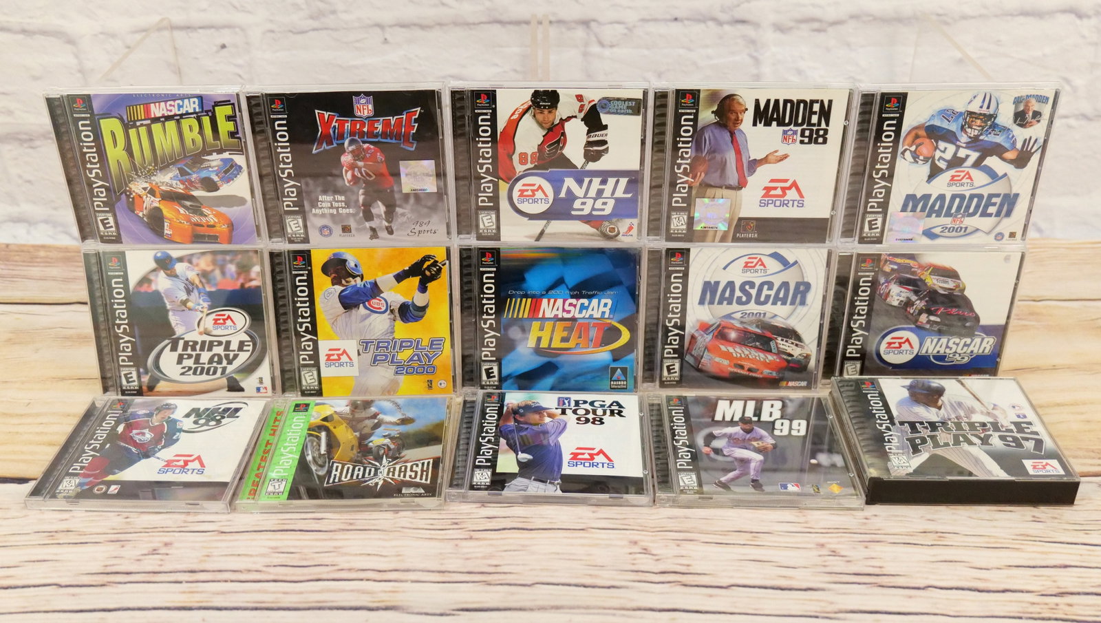 Lot of 15 Sony PlayStation Sports Related Video Games: Lot of 15 Sony PlayStation Sports Related Video Games including NASCAR Rumble, NASCAR 99, NASCAR Heat, NASCAR 2001, Triple Play 97 - Missing one disk, Triple Play 2000, Triple Play 2001, MLB 99, Road 