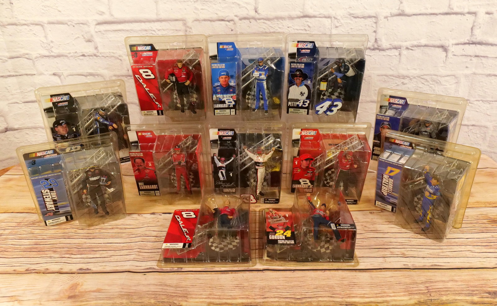 Lot of 12 McFarlane NASCAR Figures: Lot of 12 McFarlane NASCAR Figures including Ryan Newman, Richard Petty, Dale Earnhardt Jr, Dale Earnhardt, Jeff Gordon, Jimmie Johnson, Darrell Waltrip and Tony Stewart. Includes some duplicates. New