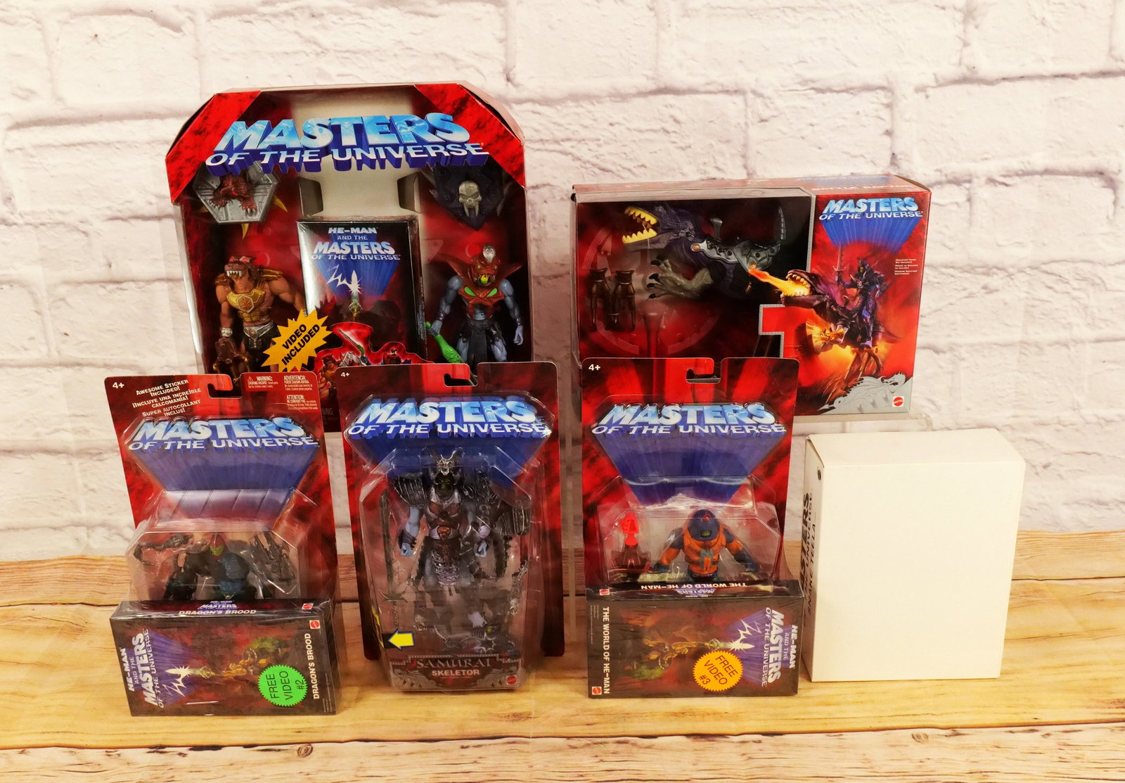 Lot of Mattel Masters of the Universe Collectibles: Lot of Mattel Masters of the Universe Collectibles from the Early 2000's including Samurai Battle Raptor, Wolf Armor He-Man & Snake Armor Skeletor with VHS, and Action Figures of Snake Teela, Samurai 