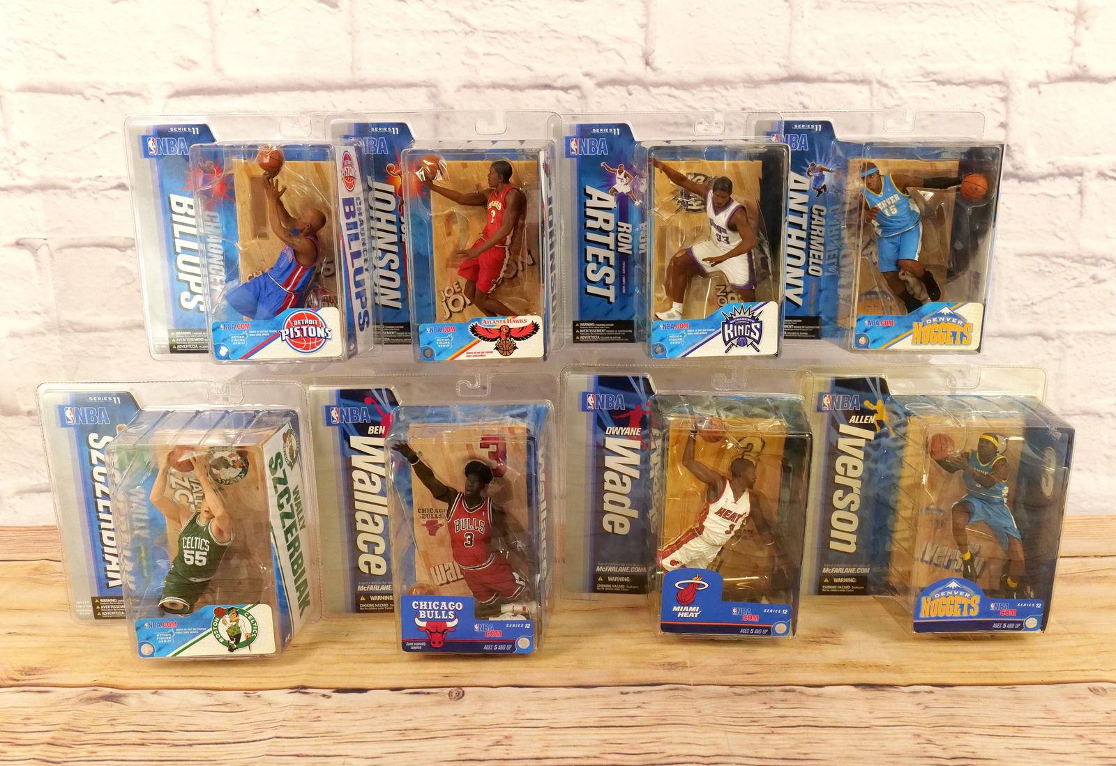 Lot of 8 McFarlane NBA Figures - Series 11 & 12: Lot of 8 McFarlane NBA Figures - Series 11 & 12. Includes Series 11 - Carmelo Anthony, Willy Szczerbiak, Chauncey Billups, Ron Artest, and Joe Johnson. Series 12 Figures include Dwayne Wade, Allen Ive
