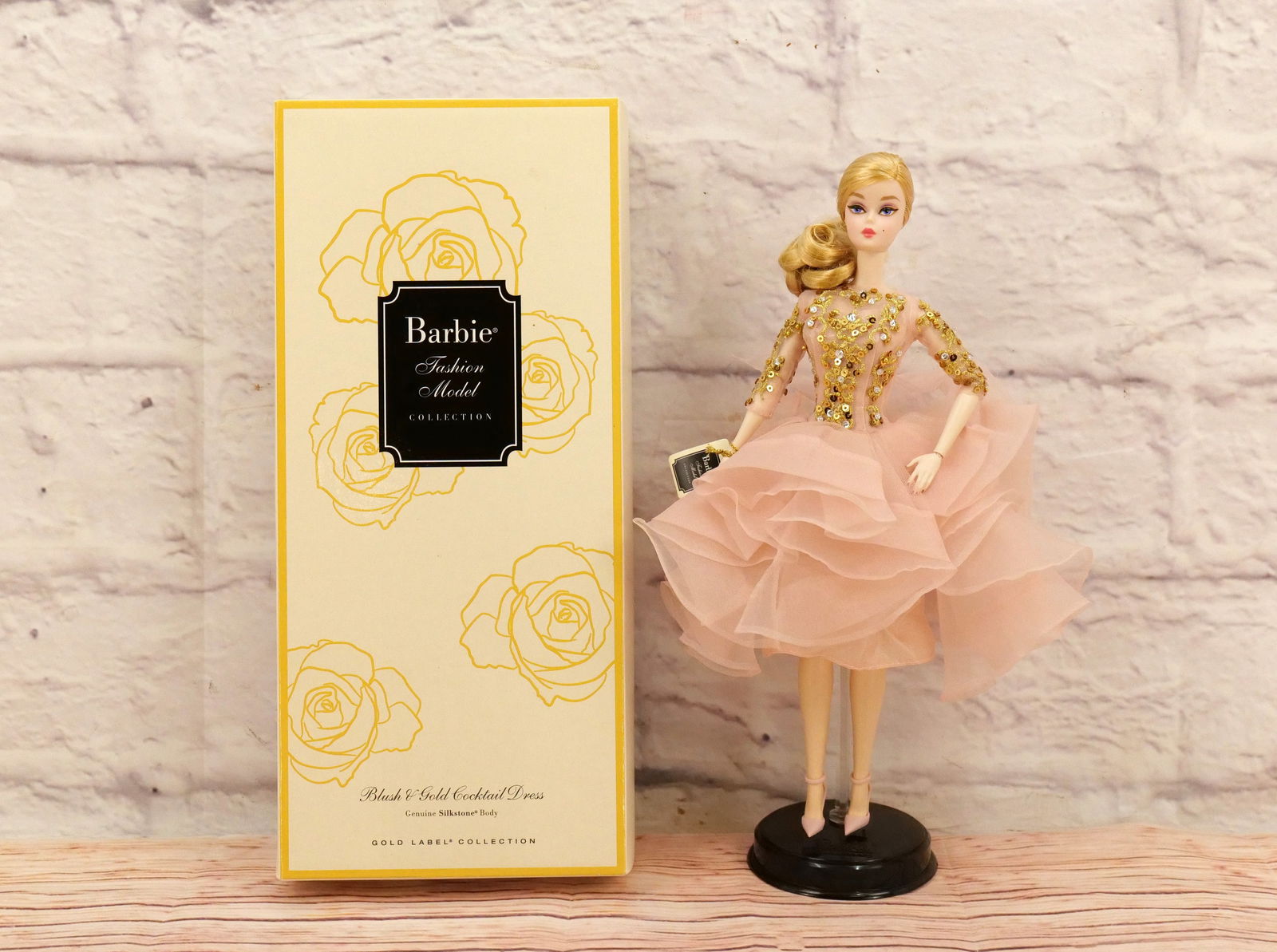 Silkstone Blush & Gold Cocktail Dress Barbie Doll: Silkstone Blush & Gold Cocktail Dress Barbie Doll - Barbie Fashion Collection - Gold Label. Complete in Box. This collection came from an estate who did enjoy and display many of her Barbies. All invo