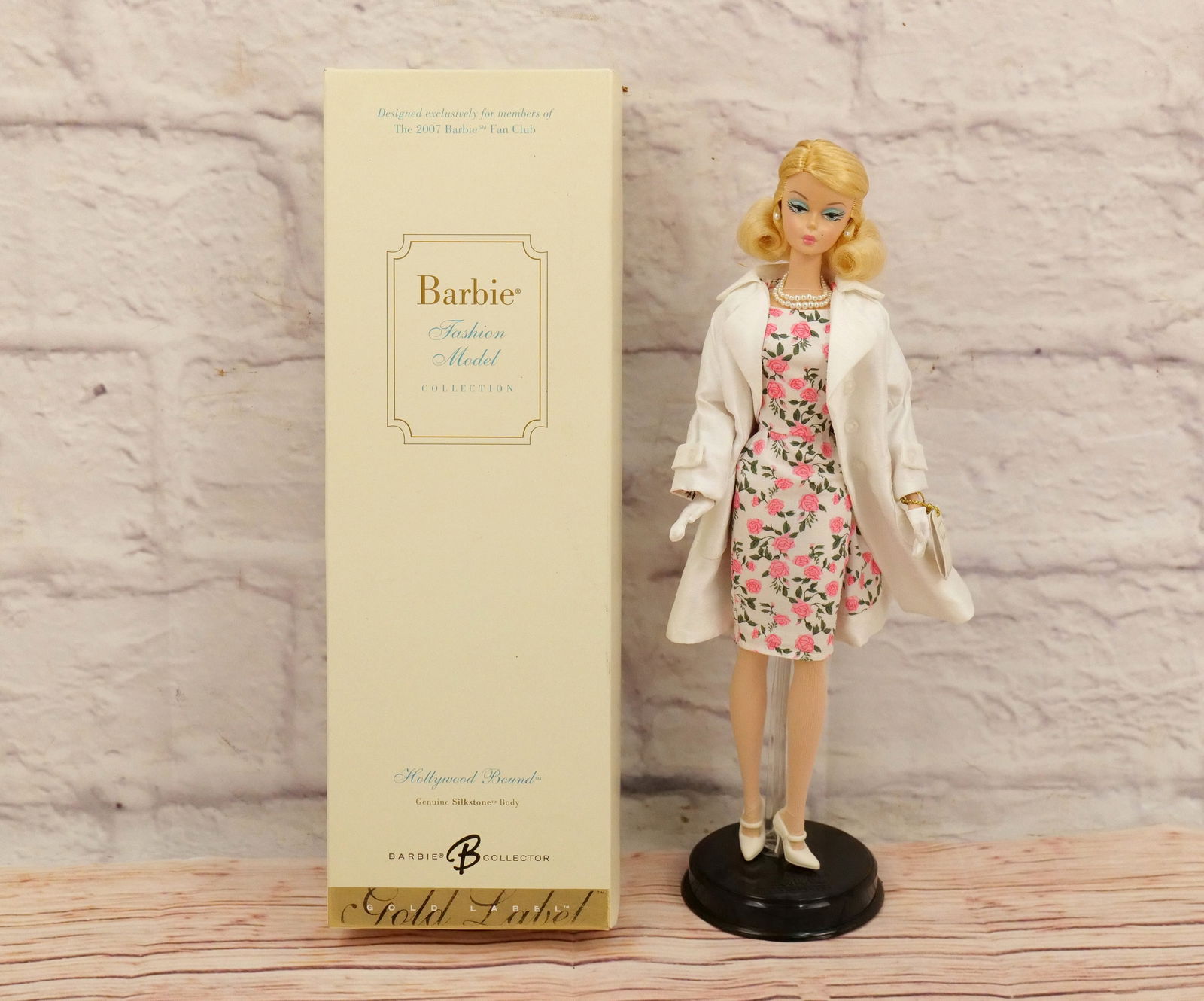 Silkstone Hollywood Bound Barbie Doll: Silkstone Hollywood Bound Barbie Doll - Barbie Fashion Model Collection - Barbie Collector Gold Label. Complete in Box. Her bag is a little "sticky". This collection came from an estate who did enjoy