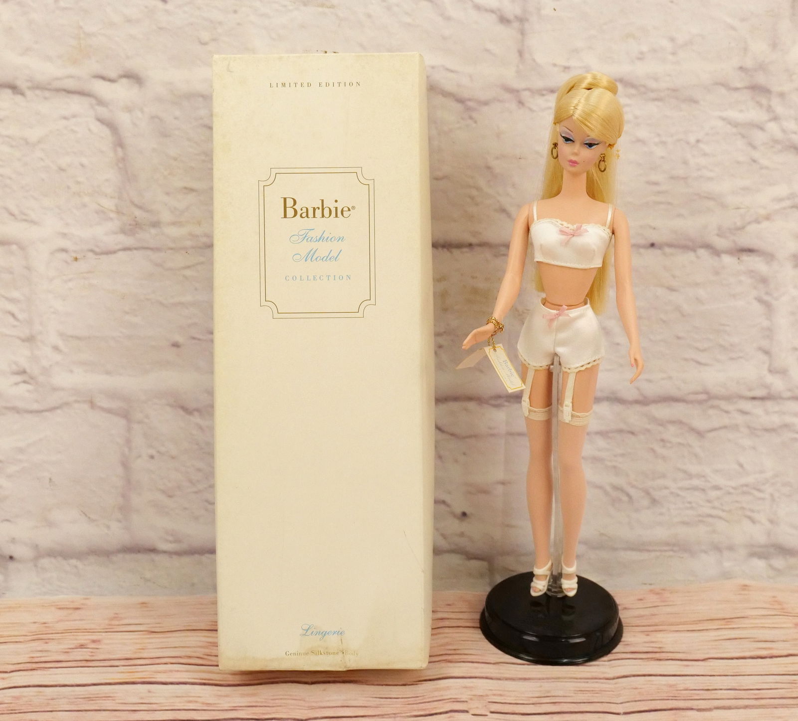 Silkstone Lingerie Barbie Doll: Silkstone Lingerie Barbie Doll - Barbie Fashion Model Collection - Limited Edition Gold Label. Complete in Box. Blonde with White Lingerie. Box has some old water damage and foxing present. This colle