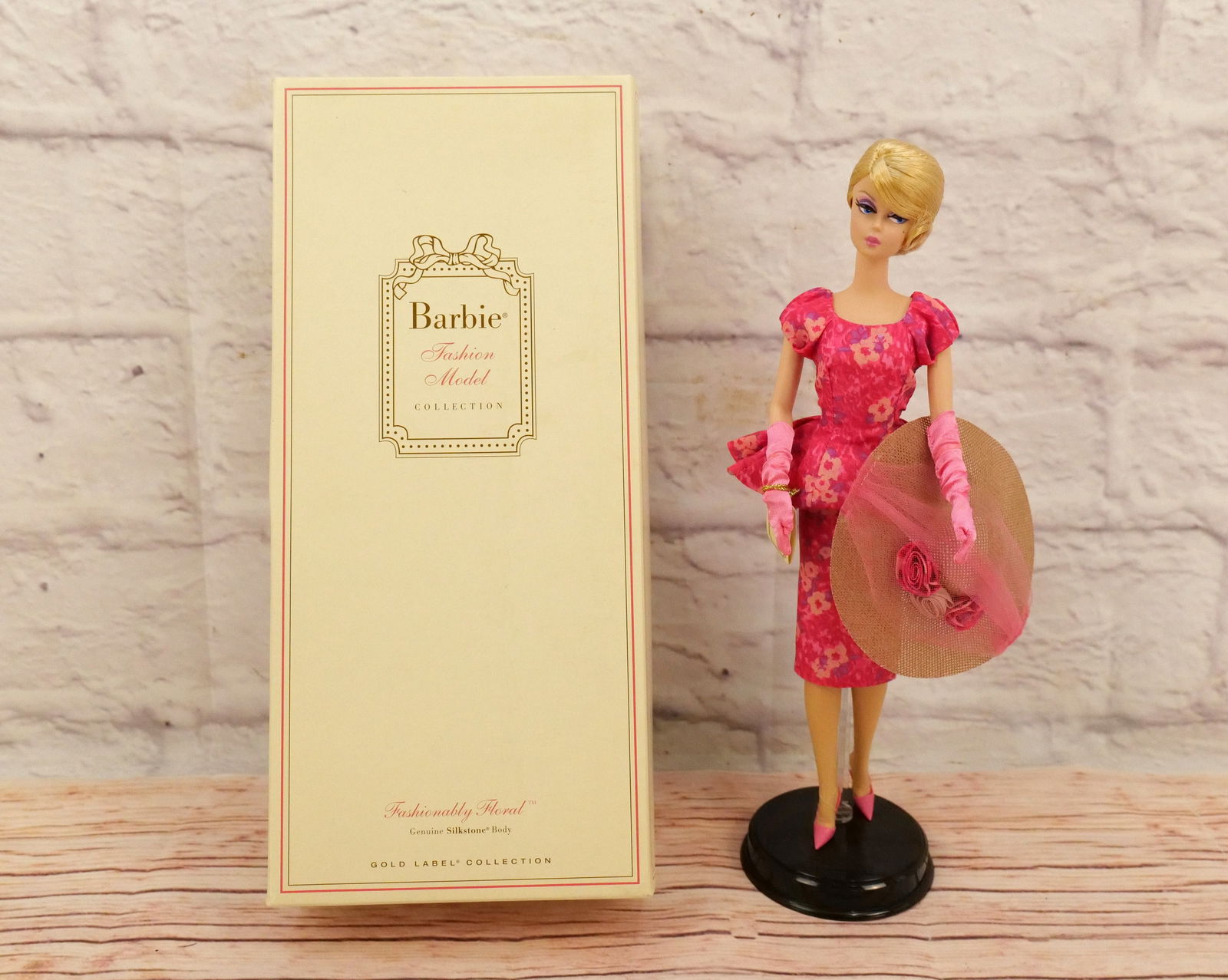 Silkstone Fashionably Floral Barbie Doll: Silkstone Fashionably Floral Barbie Doll - Barbie Fashion Model Collection - Gold Label. Complete in Box. One of the slingback shoes are broken. This collection came from an estate who did enjoy and d