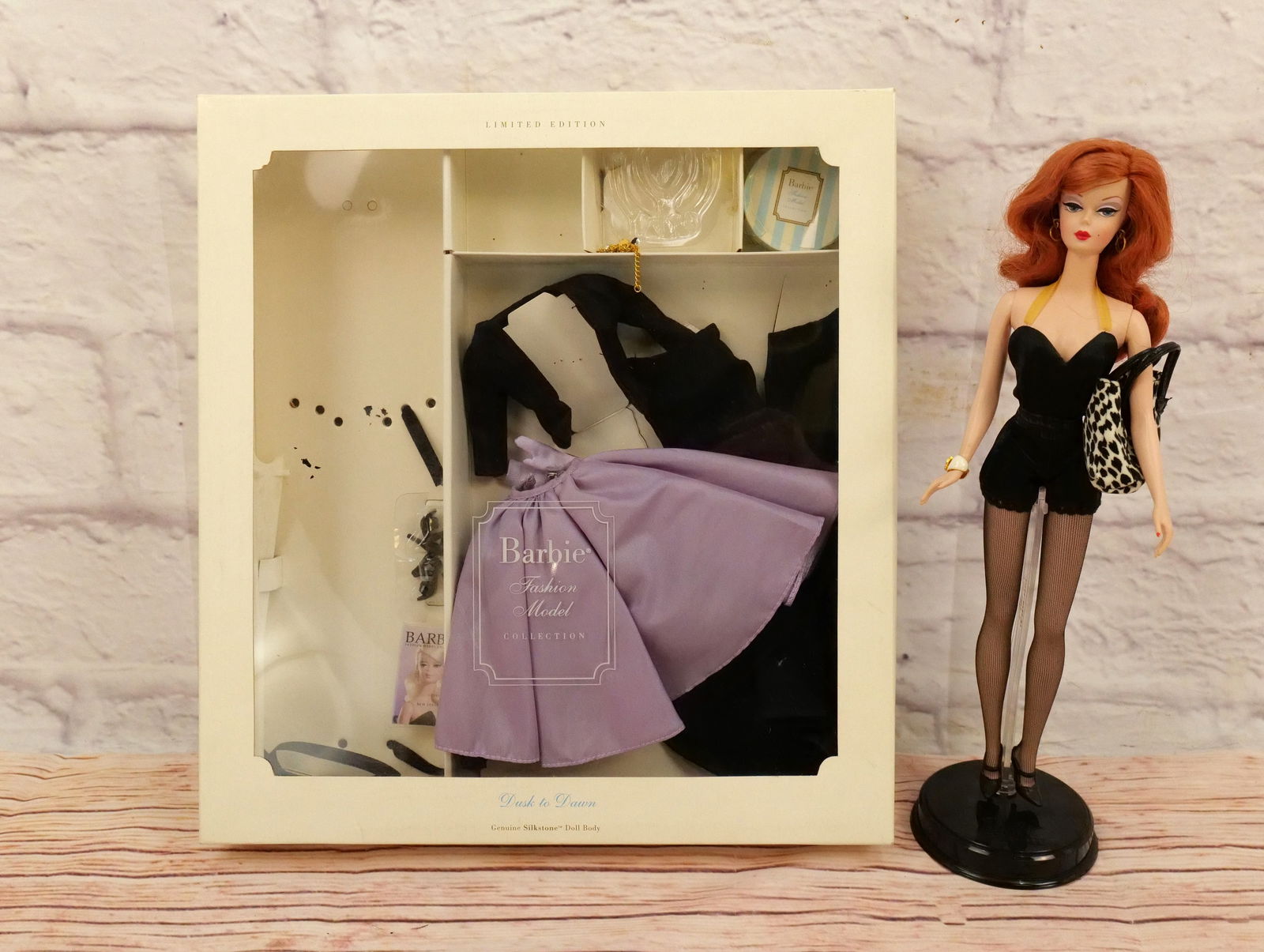 Silkstone Dusk to Dawn Barbie Doll Giftset: Silkstone Dusk to Dawn Barbie Doll Giftset - Barbie Fashion Model Collection - Limited Edition. Missing 1 of her gold chains. Otherwise Complete. This collection came from an estate who did enjoy and