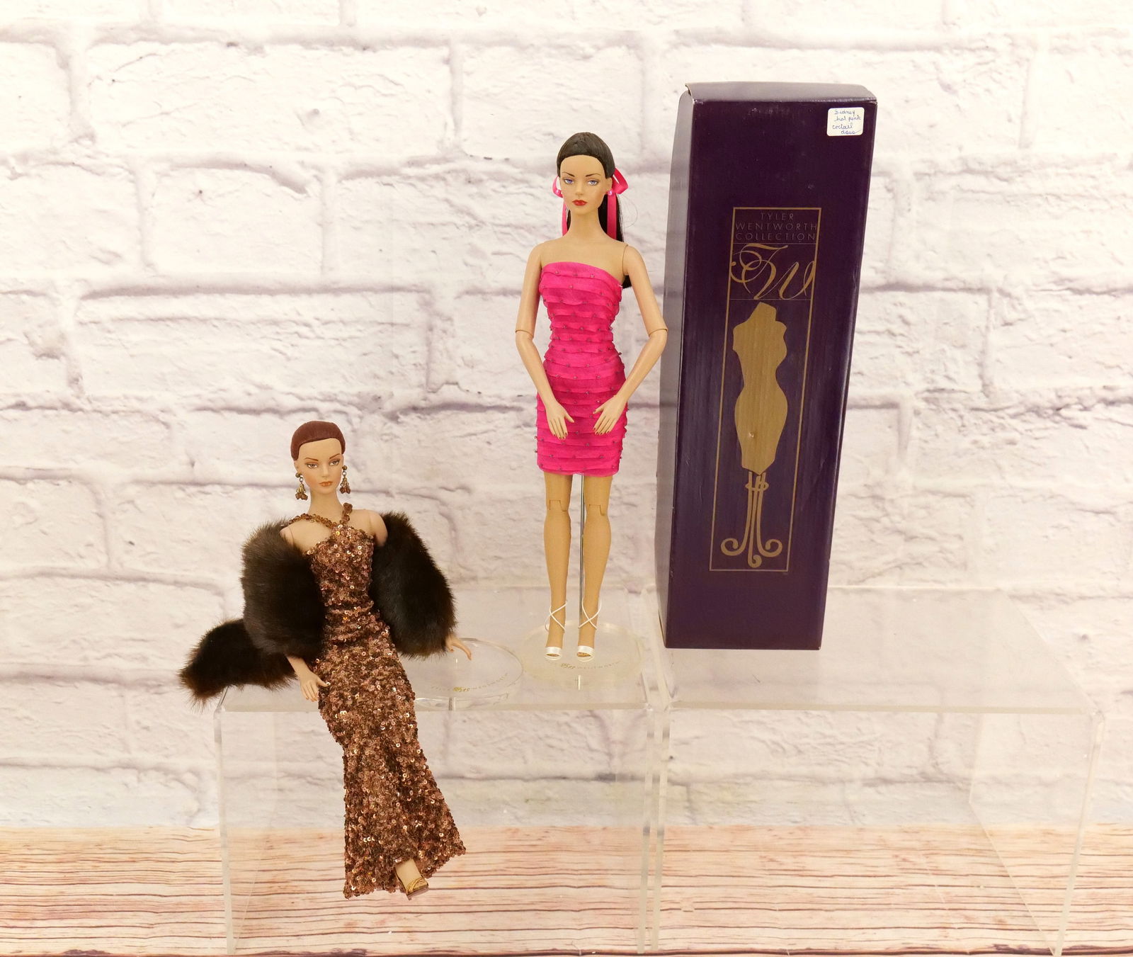 Lot of 2 Tyler Wentworth/Tonner Sydney Dolls: Lot of 2 Tyler Wentworth/Tonner Sydney Dolls including Ready-To-Wear Shimmer Sydney in Box and 24K Sydney Chase - Loose - No Box. Dolls measure approx. 16". This collection came from an estate who did