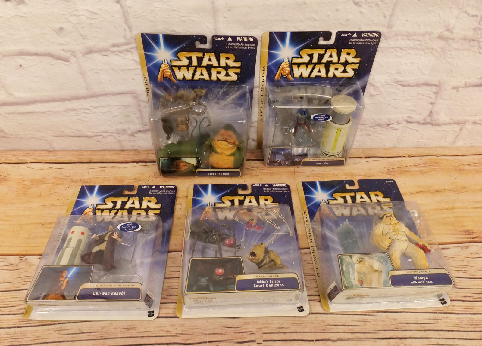 Lot of 5 Hasbro Star Wars Action Figures: Lot of 5 Hasbro Star Wars Action Figures including Jabba the Hutt, Court Denizens, Obi-Wan Kenobi, Wampa with Hoth Cave, and Jango Fett. All invoices must be paid within 24 hours of the sale. We offer