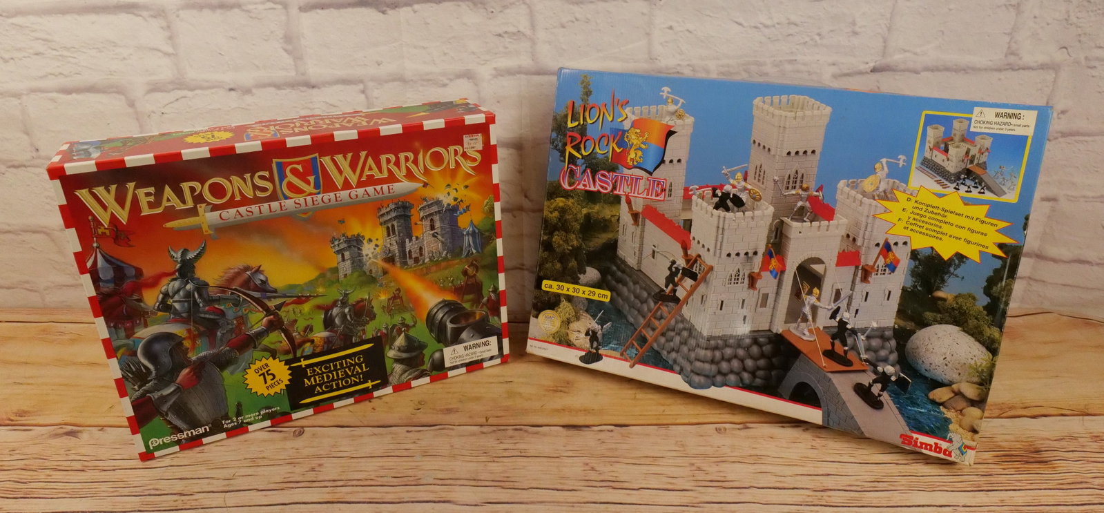 Lot of 2 Castle Playsets: Lot of 2 Castle Playsets including Weapons and Warriors by Pressman and Lions Rock Castle by Simba - Missing Castle - Very Incomplete - Random Items inside box. Both boxes are opened. Unverified if co