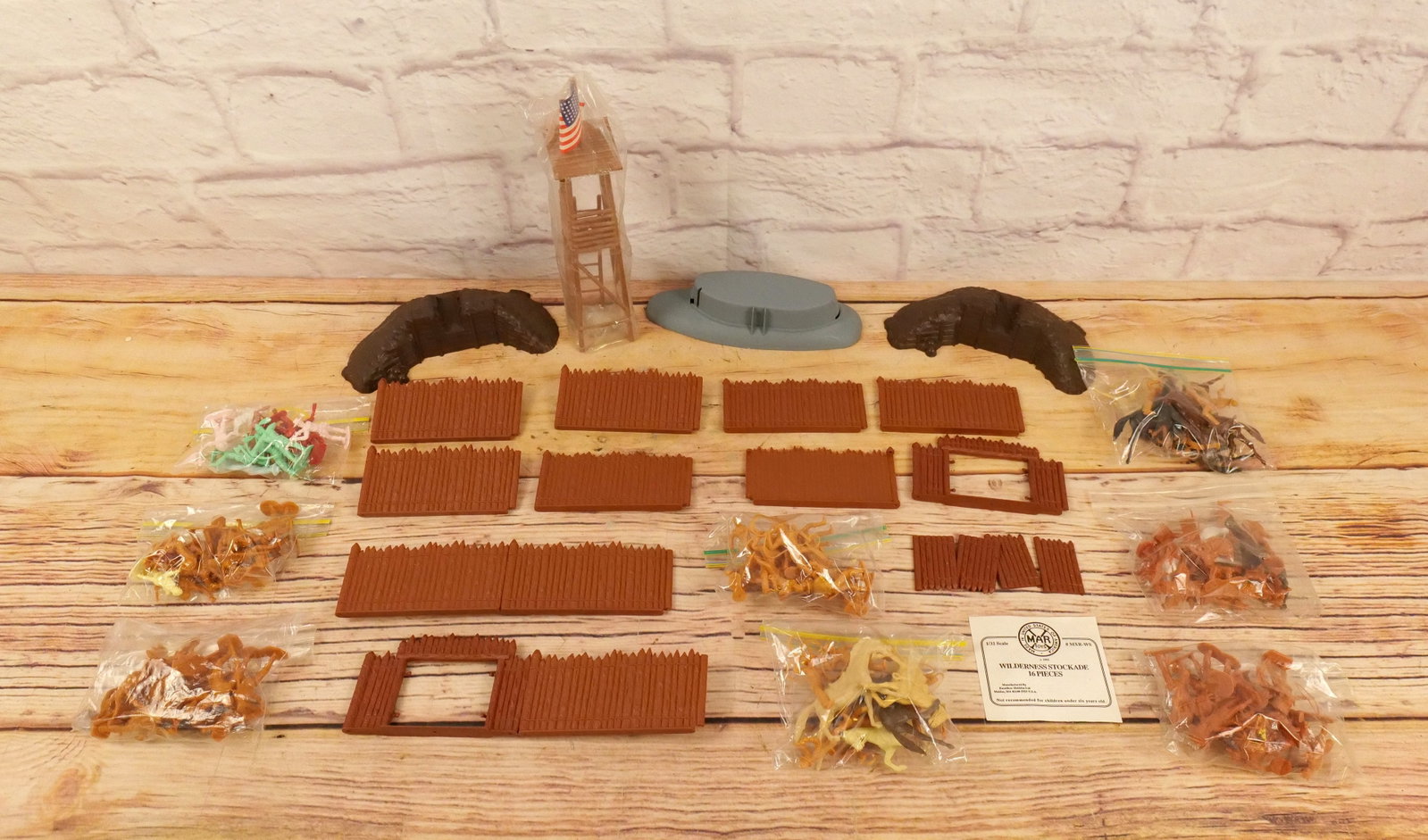 Lot of Marx Parts and Figures: Lot of Marx Parts and Figures. Parts go to the Wilderness Stockade. And Figures are mixed. Mostly Cowboys with Lassos on Horseback. All invoices must be paid within 24 hours of the sale. We offer mult