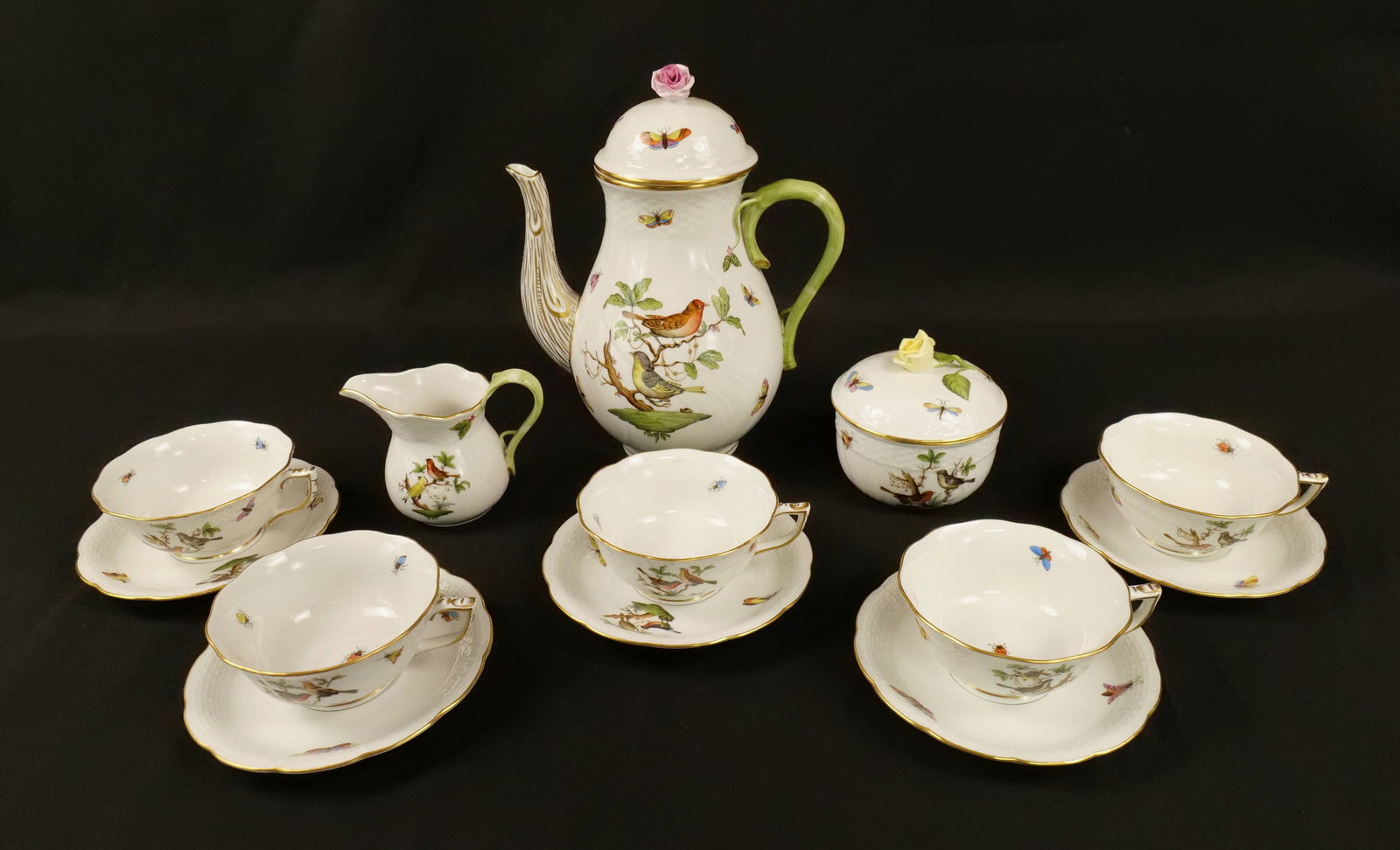 Herend Rothchild Tea Service Set: Herend hand painted porcelain Rothchild Tea Service. Set contains nice oversized teapot measuring 10.5" tall by 8" wide that has a missing stem on the flower lid, creamer, sugar and 5 cup and saucers