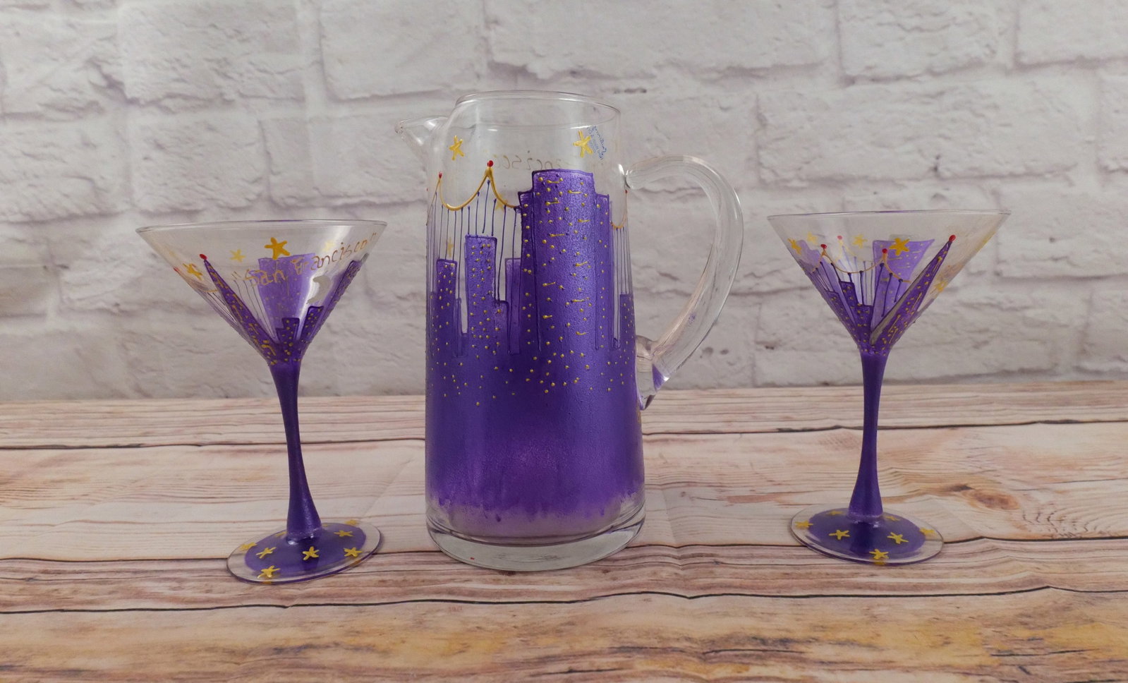 Hand Painted Pitcher with 2 Martini Glasses: Hand Painted Pitcher with 2 Martini Glasses. Marked San Francisco by Vikki '98 AM. Pitcher measures 9" tall. All invoices must be paid within 24 hours of the sale. We offer multiple shipping options, 