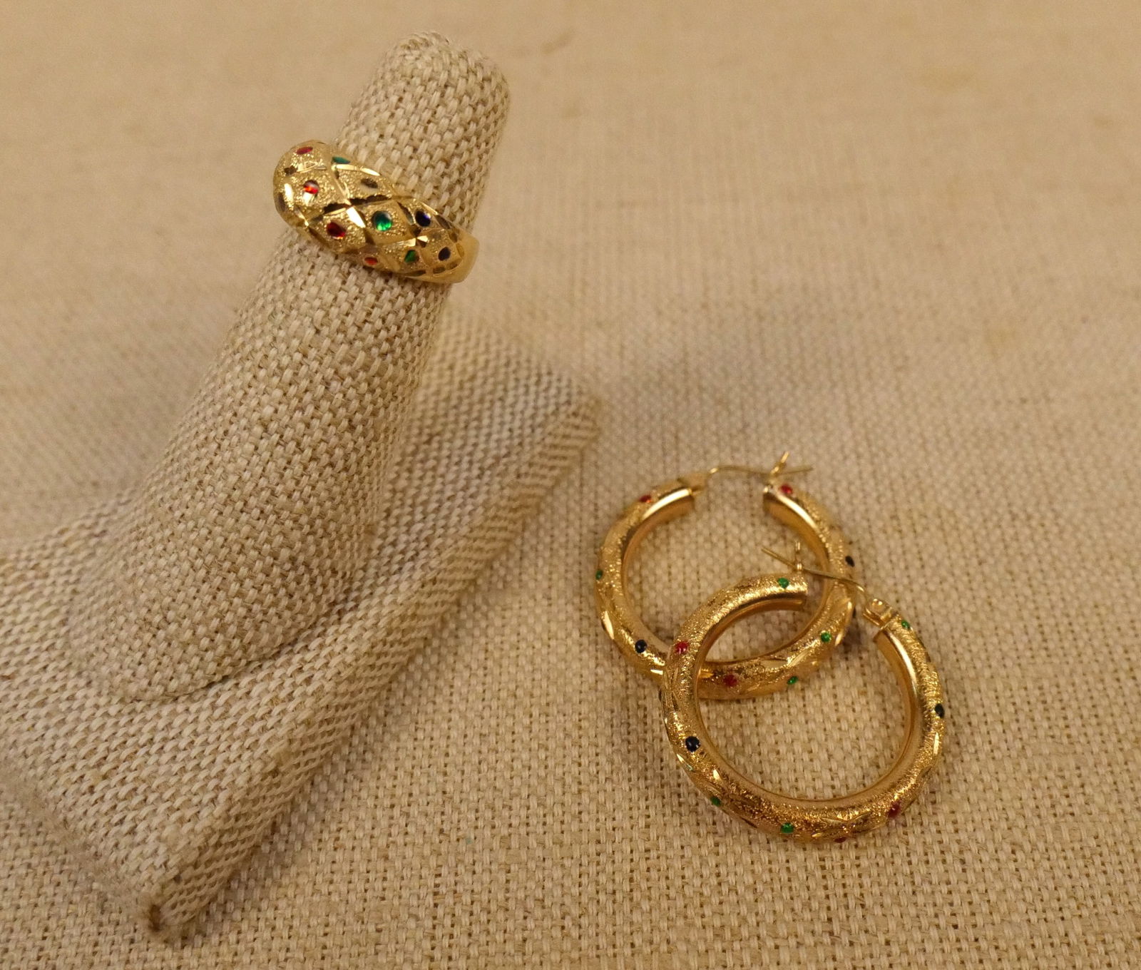 Matching 14K Yellow Gold Hoops and Ring: Matching 14K Yellow Gold Hoops and Ring. 1 pair of hollow hoops and a matching 14k yellow gold domed ring featuring a textured ground with hand etching and applied enamel dots in shades of green, blue