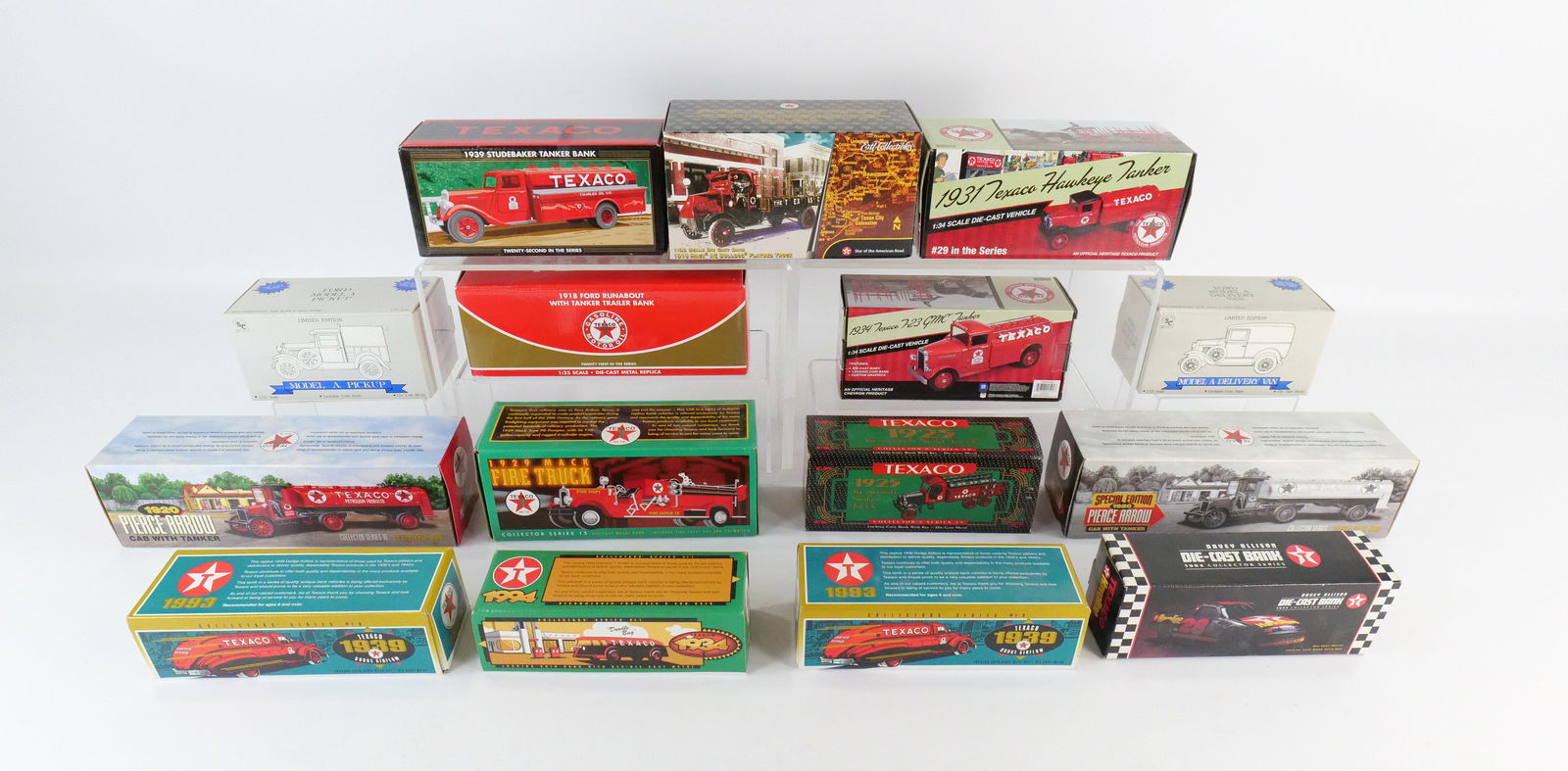 Lot of 15 Diecast Banks: Lot of 15 Diecast Banks including Texaco from Various Makers (Ertl, RC2), and Liberty Ford Model A. All new in original boxes. All invoices must be paid within 24 hours of the sale. We offer multiple