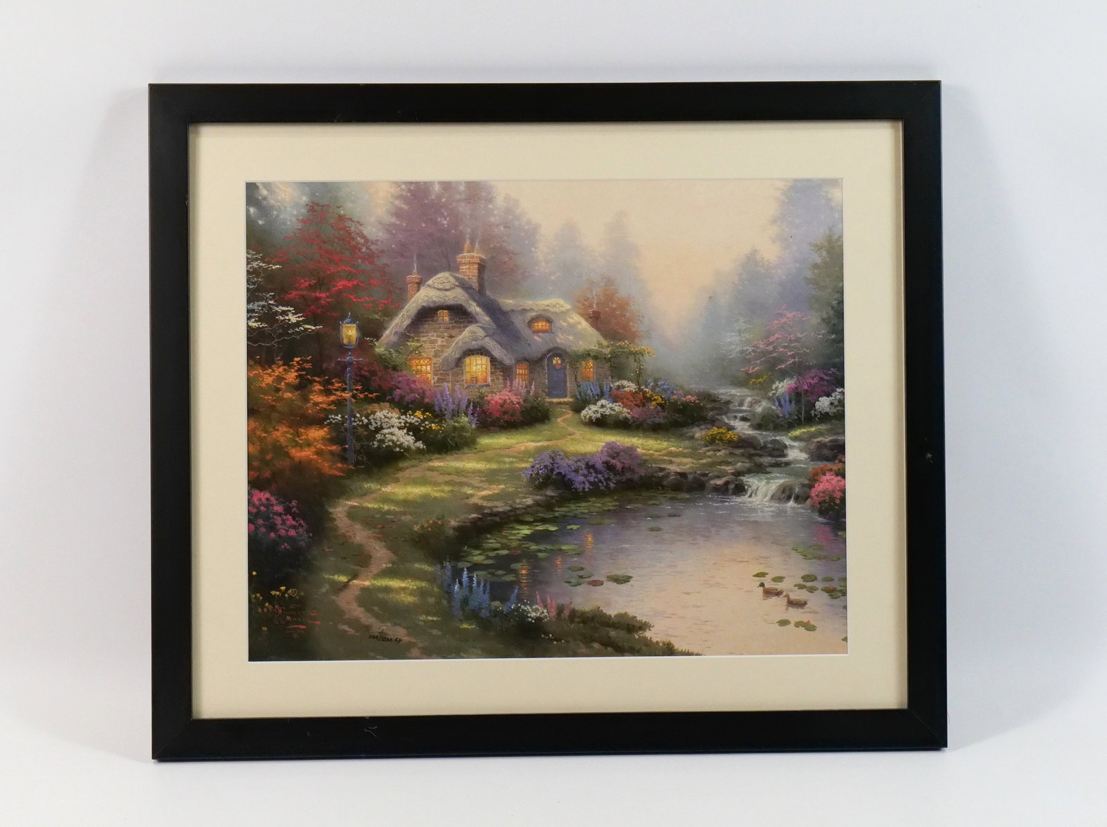 Thomas Kinkade Lithograph "Everett's Cottage": Thomas Kinkade Lithograph "Everett's Cottage". Signed and Numbered. Dated 1998. Limited #359/2050. Comes with COA from Fine Art Sales Florida and Appraisal Form. Some dings to the frame. Measures 22"