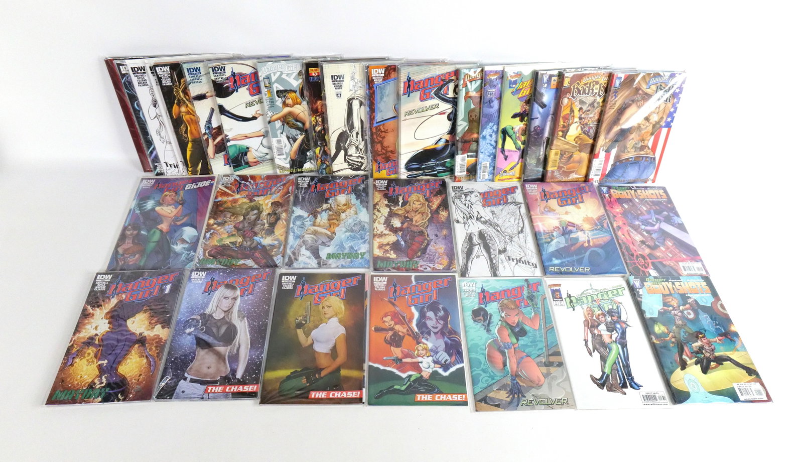 Lot of IDW Danger Girl Comics: Lot of IDW Danger Girl Comics. Includes The Chase #1&2 (Multiples), MayDay #1-4 (Multiples), Danger Girl/GI Joe #5, Revolver #1-5 (Multiples), Trinity, Renegade #1&2, and Army of Darkness #5&6. Averag