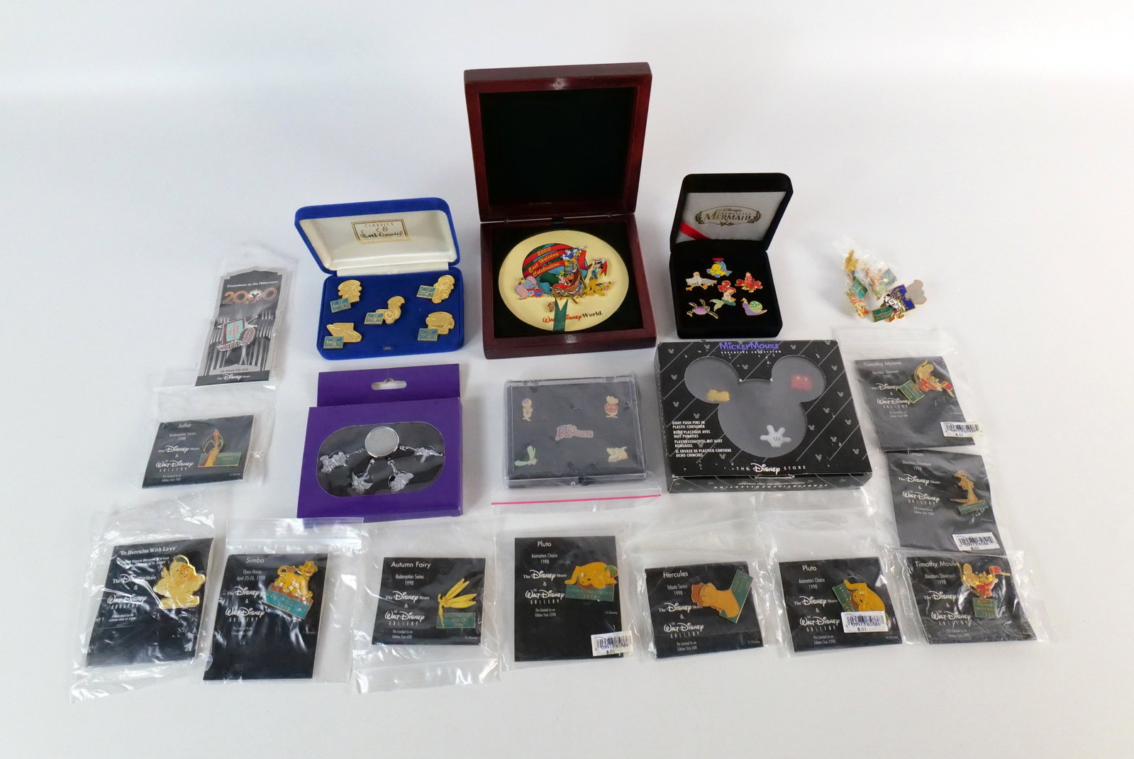 Lot of Disney Pins and Commemorative Sets: Lot of Disney Pins and Commemorative Sets including WDCC Production Marks, Walt Disney Gallery, The Rescuers, 2000 Cast Holiday Celebration, and More. All invoices must be paid within 24 hours of the 
