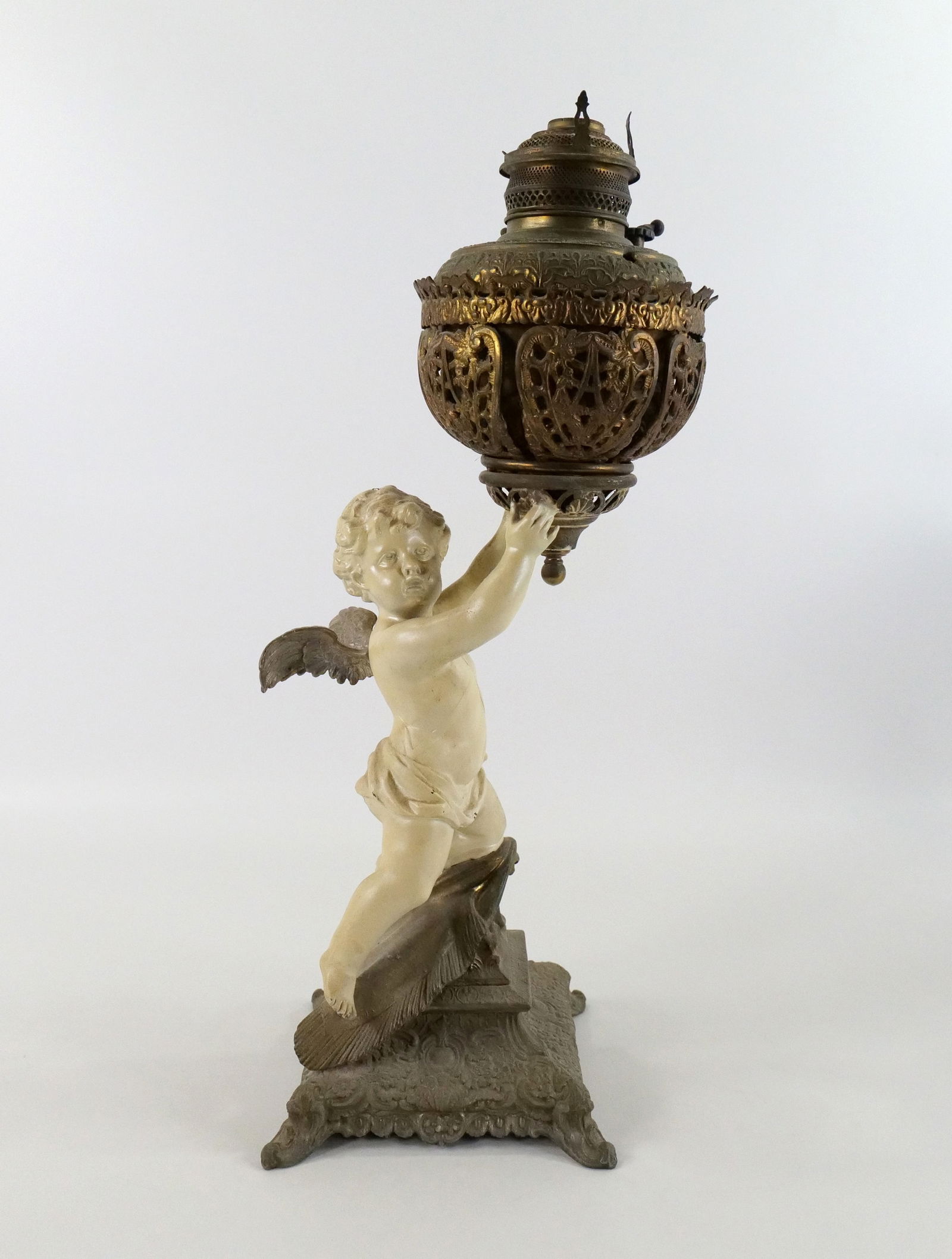 19th Century Mixed Metal Cherub Piano Lamp: 19th Century Mixed Metal Cherub Piano Lamp. Has been electrified. Measures 23" tall x 8" wide. All invoices must be paid within 24 hours of the sale. We offer multiple shipping options please read the