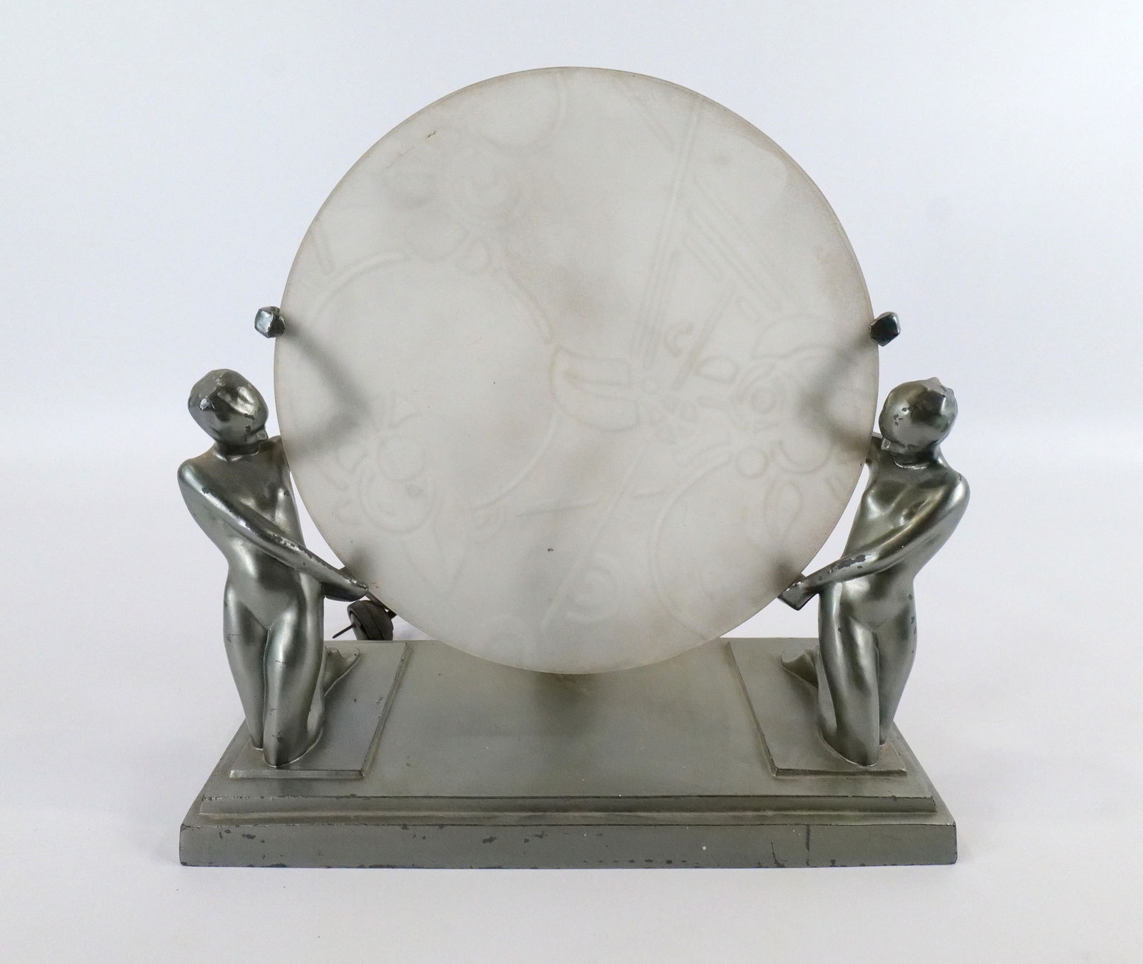 Art Deco Frankart Mantle Lamp: Art Deco Frankart Mantle Lamp. Depicting 2 Nude Women holding Frosted Etched Round Shape. Signed Frankart on back. Minor paint loss throughout. Overall very good condition. Shade is 10" diameter. Meas