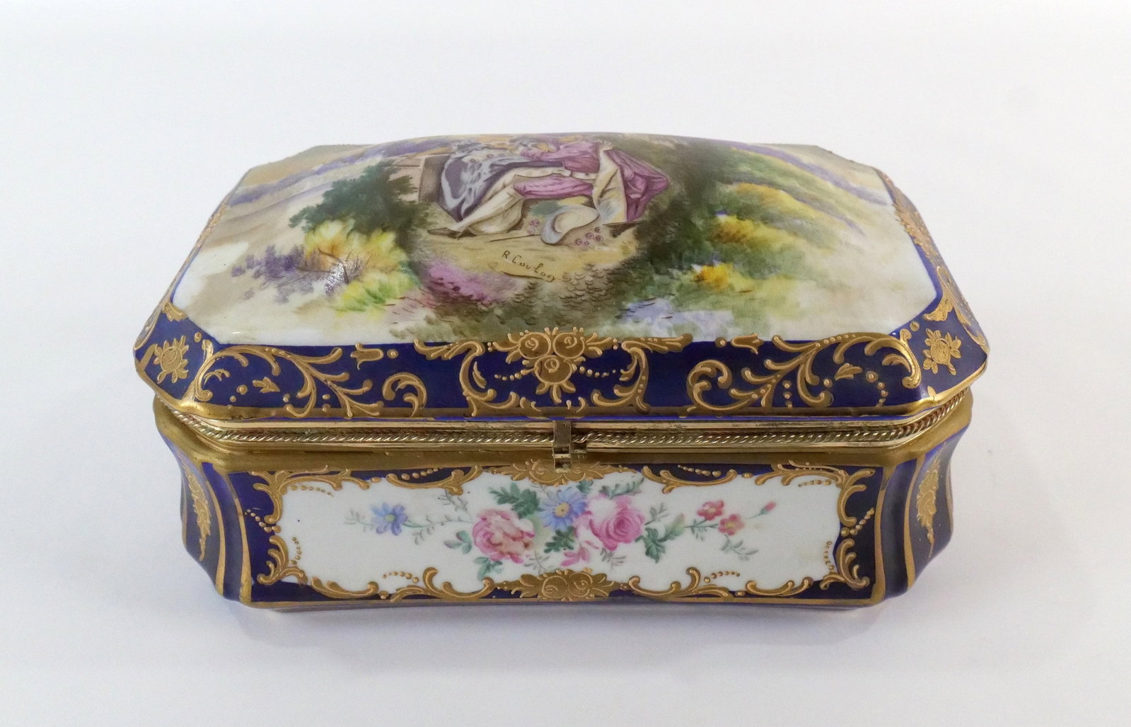 Late 20th Century Oversized Dresser Box: Late 20th Century Limoges Style Oversized Dresser Box. Transferware with Hand Painted Accents. Also has interior flower decoration. Artist Signed. Measures 5.5" tall x 10.5" long x 6.5" wide. All invo