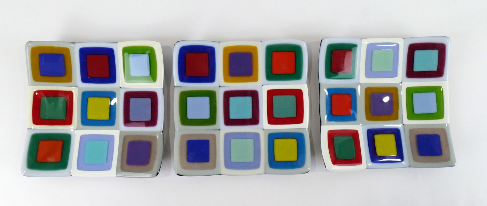 Lot of 3 Art Glass Trivet Plates: Lot of 3 Art Glass Trivet Plates. Signed on Back J. Tivol 2003. Measures 8.5" x 8.5" wide. All invoices must be paid within 24 hours of the sale. We offer multiple shipping options please read the shi