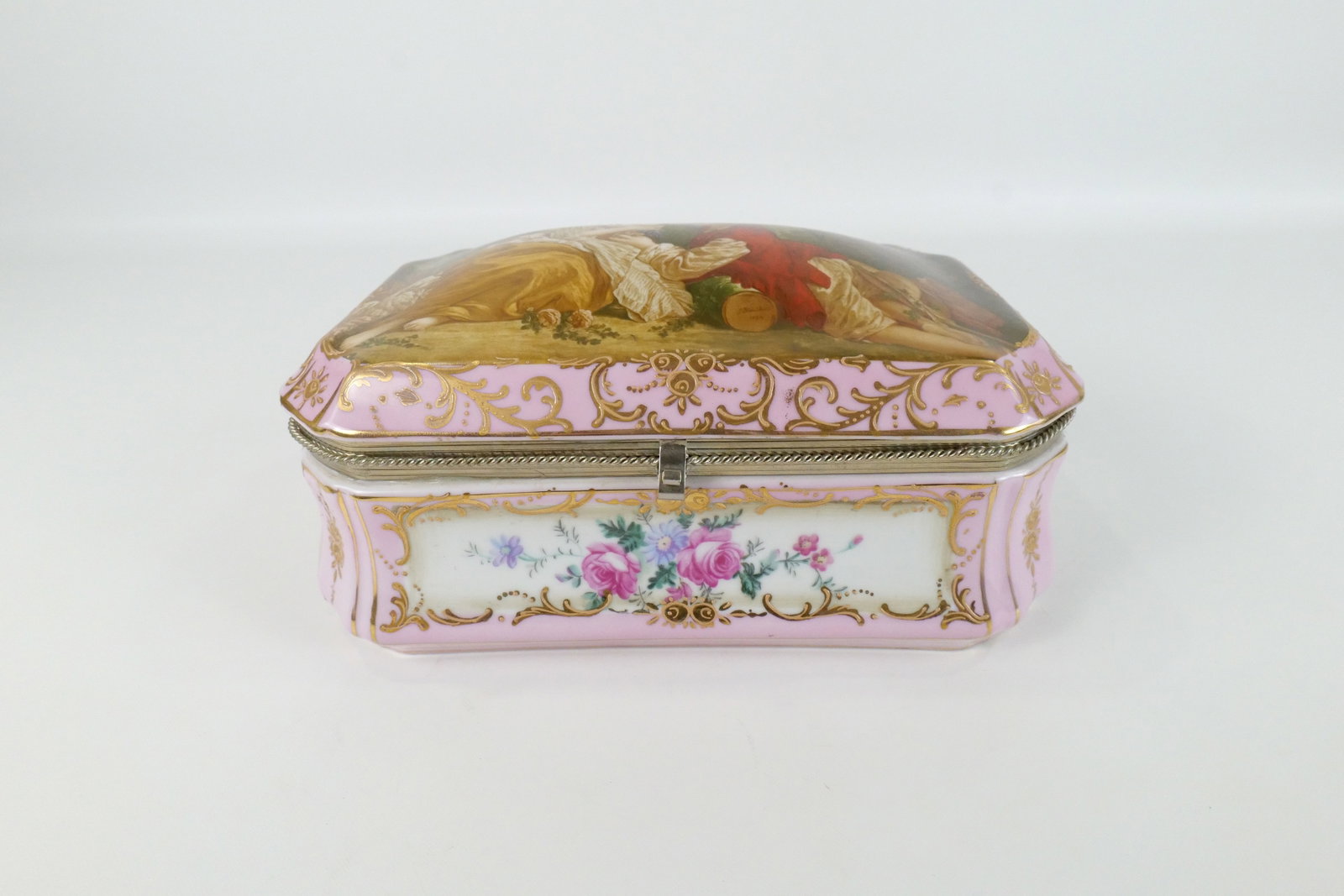 Porcelain Jewelry/Dresser Box: Porcelain Jewelry/Dresser Box. In the manner of Limoges. Transferware with Hand Painted Highlights. Top is not latching properly. Otherwise appears to be in good condition. Measures 5.5" tall x 11" wi