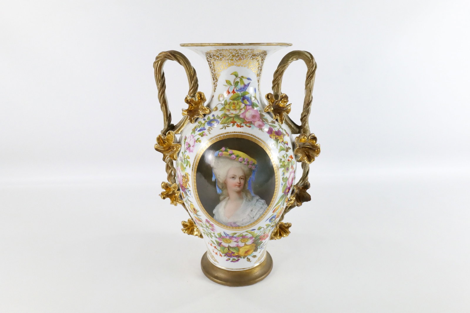 19th Century Old Paris Portrait Double Handled Vase: 19th Century Old Paris Hand Painted Portrait Double Handled Vase. Depicting a bust of a woman. Nice flower design around the handles. Minor gold loss by the rim but overall good condition. Measures 17