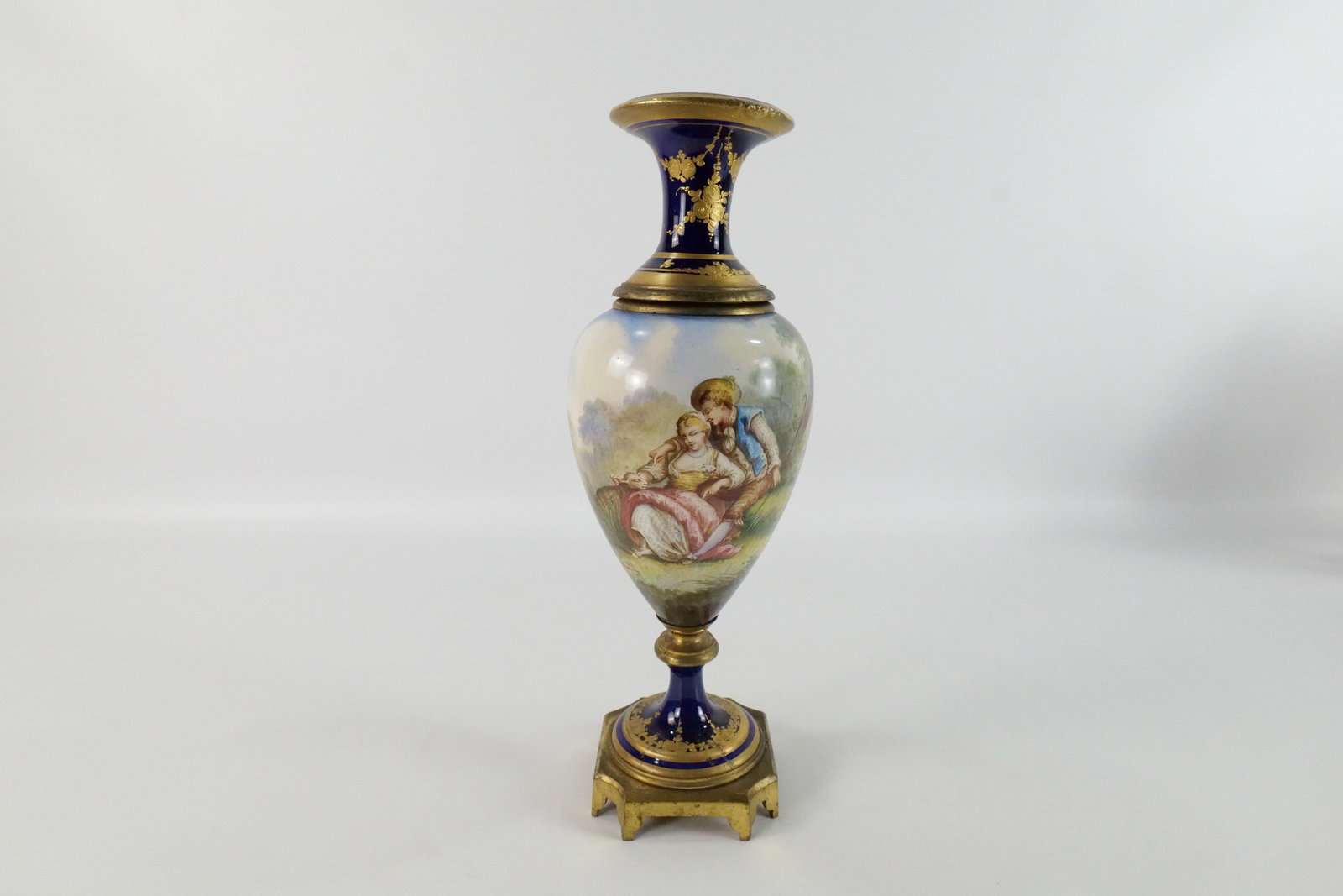 19th Century Hand Painted Urn/Vase: 19th Century Hand Painted Urn. Artist Signed Bertren. Depicting man courting a woman. Has French Stamp on Metal Base. Most Likely Limoges. Measures 14.5" tall x 5.25" wide. All invoices must be paid w
