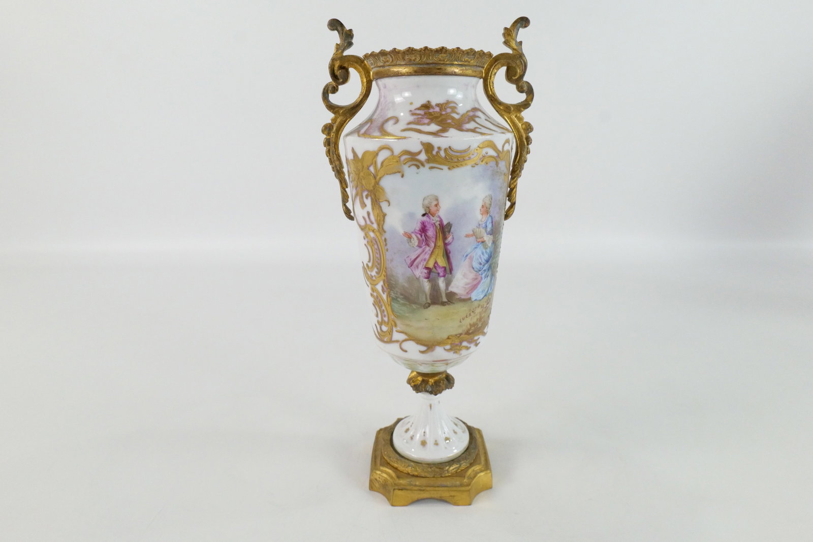 19th Century Sevres Double Handled Porcelain Urn: 19th Century Sevres Hand Painted Double Handled Porcelain Urn. Depicting Portrait of man and woman. Artist Signed - Lucas. Missing Lid. Base marked Sevres. Measures 10" tall x 4.5" wide. All invoices 