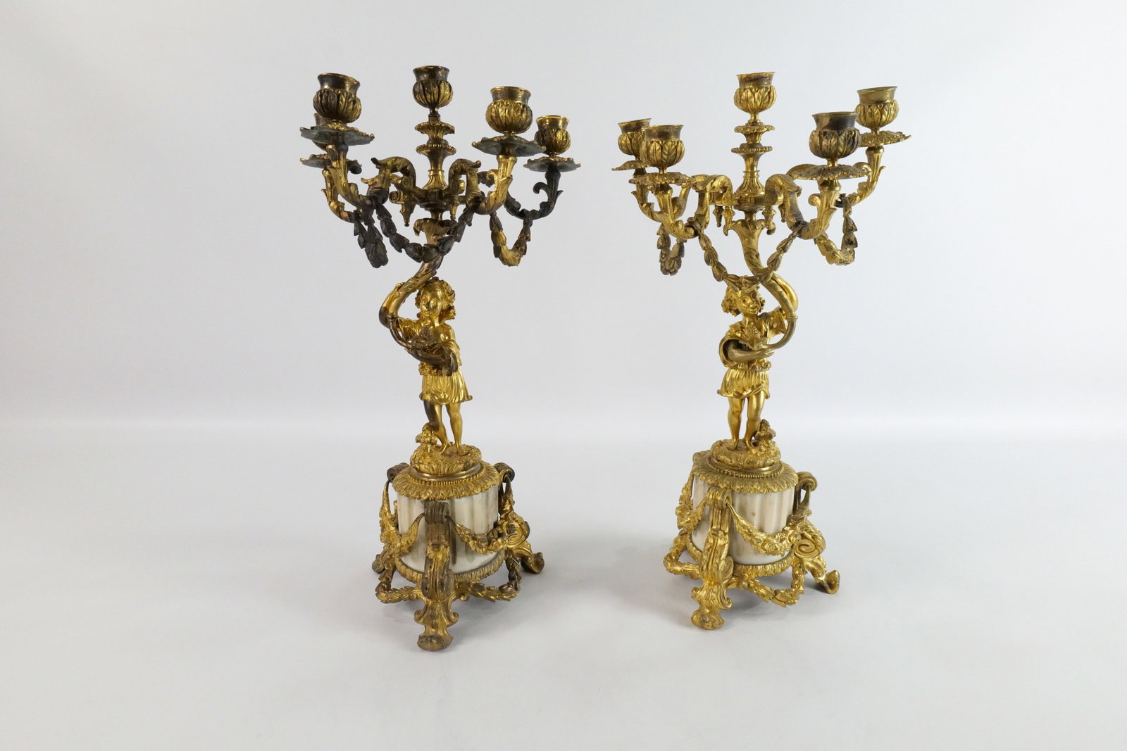 Pair of 19th Century French Bronze and Marble Base Candelabras: Pair of 19th Century French Gilt Bronze with Marble Base Candelabras. Good Condition. Measures 18" tall x 9" wide. All invoices must be paid within 24 hours of the sale. We offer multiple shipping opt