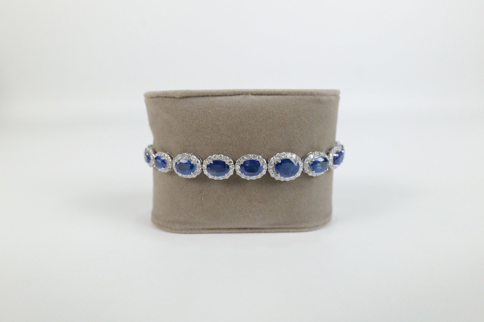 14K White Gold Sapphire and Diamond Bracelet: 14K White Gold Sapphire and Diamond Bracelet. Including 12.83 carats of Natural Sapphire Corundum's and 3.90 carats of Round Brilliant Cut Diamonds. Total Gross Weight Approx 12.6 grams. Comes with GG