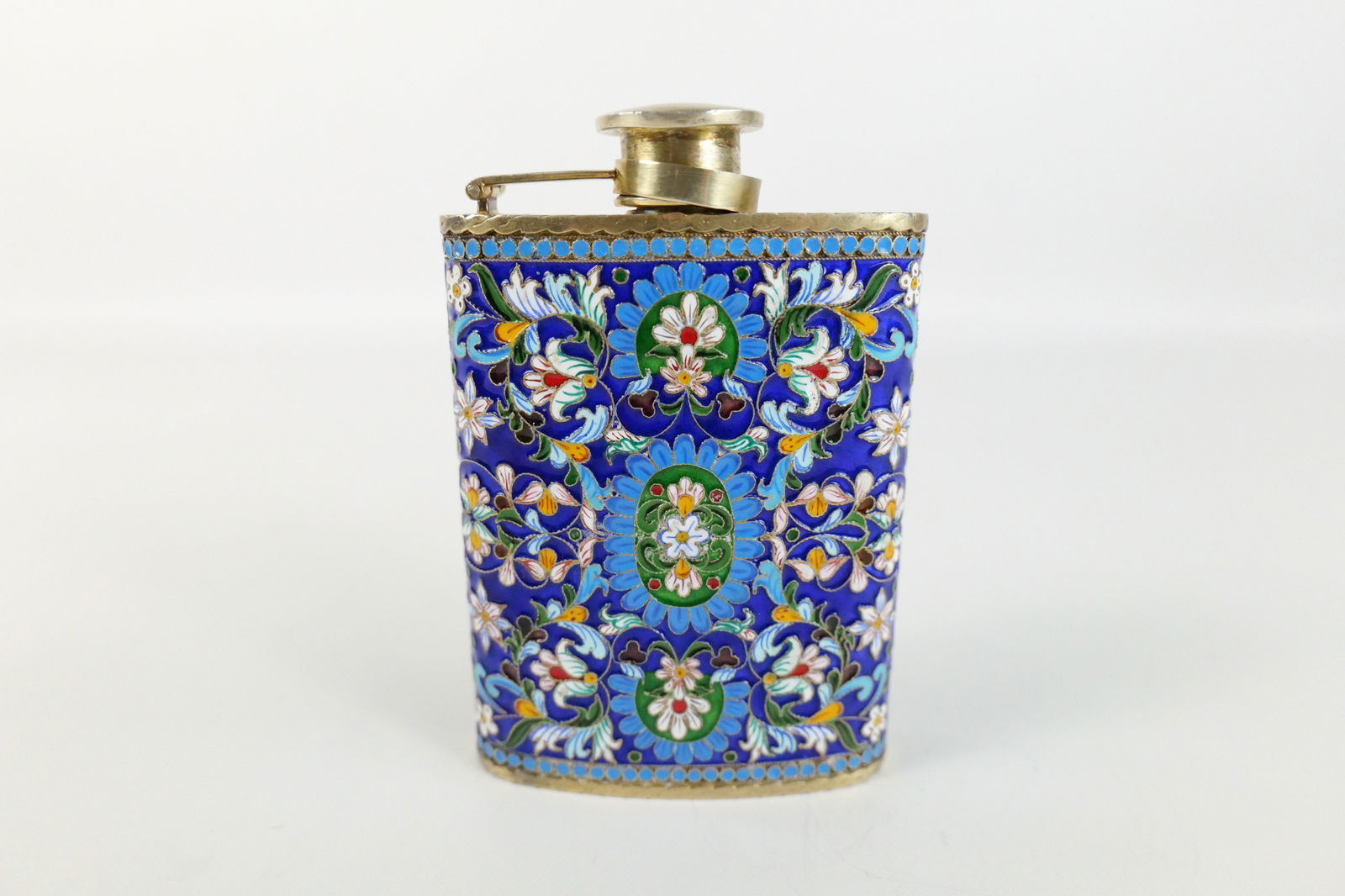 Russian Silver and Enamel Faberge Style Decorative Flask: Russian Silver and Enamel Faberge Style Decorative Flask. Flower Decoration. Marked on flask lid - Appears to be NC84. Measures 4.5" tall x 3.25" long. All invoices must be paid within 24 hours of the
