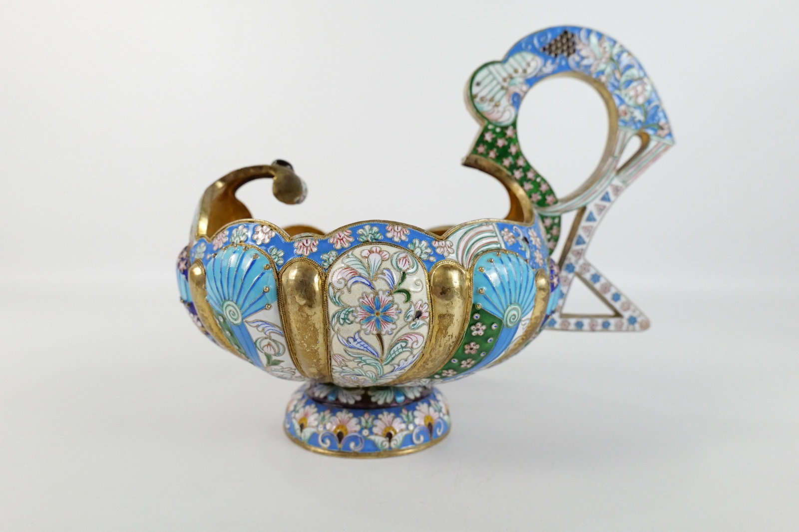 Russian Silver and Enamel Faberge Style Kovsh: Russian Silver and Enamel Faberge Style Kovsh. Flower and Grape Decoration. Gold Wash on Inside. Marked with a Head and a number 84. Oversized with Large Handle. Measures 8.5" tall x 10.5" long x 7" w