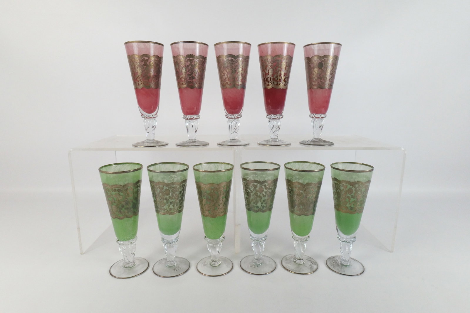Set of 11 Arte Italica Silver Overlay Glasses: Set of 11 Arte Italica Silver Overlay Glasses. Made in Italy. Good Condition. 6 in Green. 5 in Cranberry. Measures 8.25" tall x 3" diameter. All invoices must be paid within 24 hours of the sale. We o