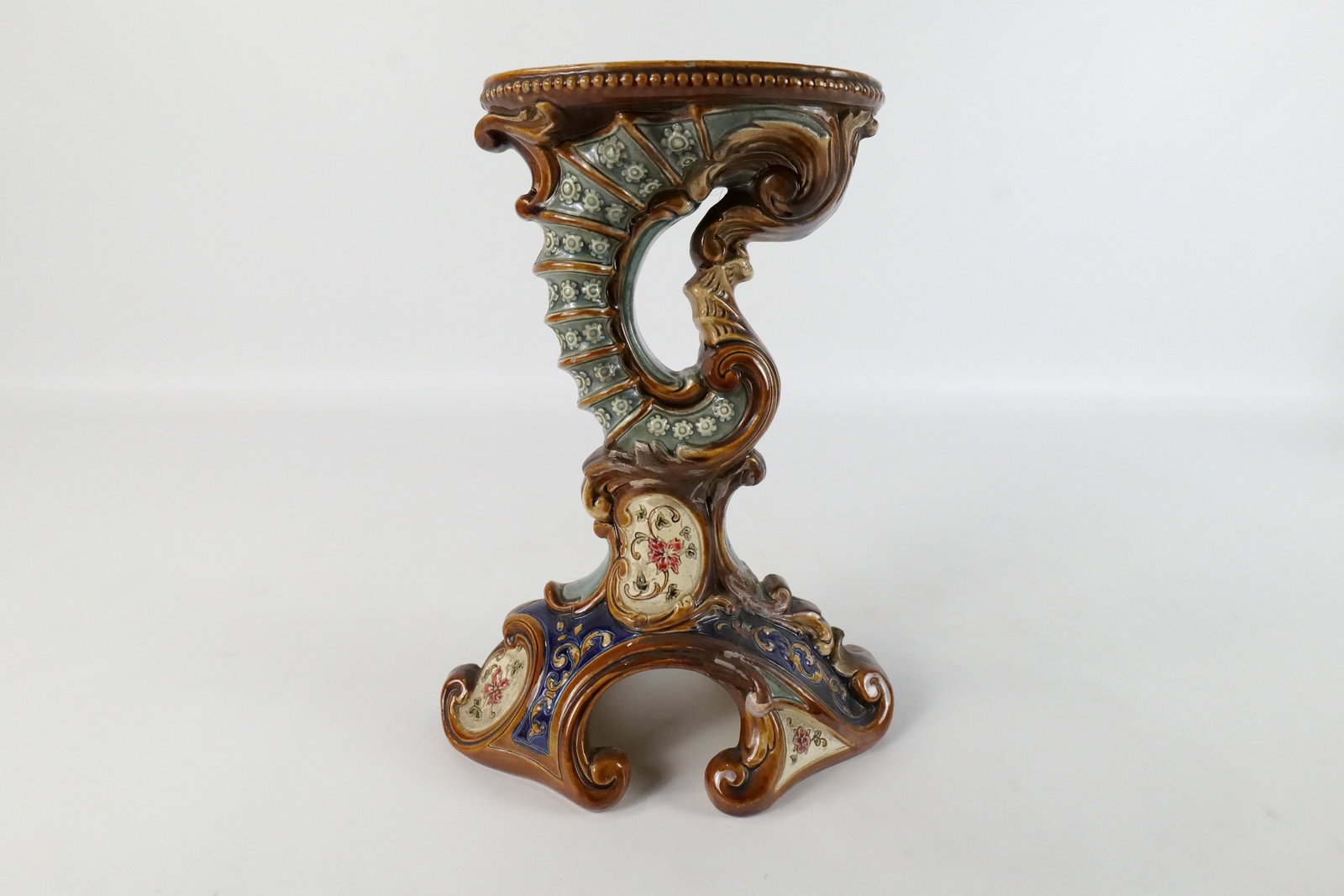 Antique Wilhelm Schiller & Sohm Majolica Pedestal: Antique Wilhelm Schiller & Sohm Majolica Pedestal #6497. Signed on bottom WS&S. Made in Austria. Has been repaired on bottom. Measures 10" tall x 7.5" diameter. All invoices must be paid within 24 hou