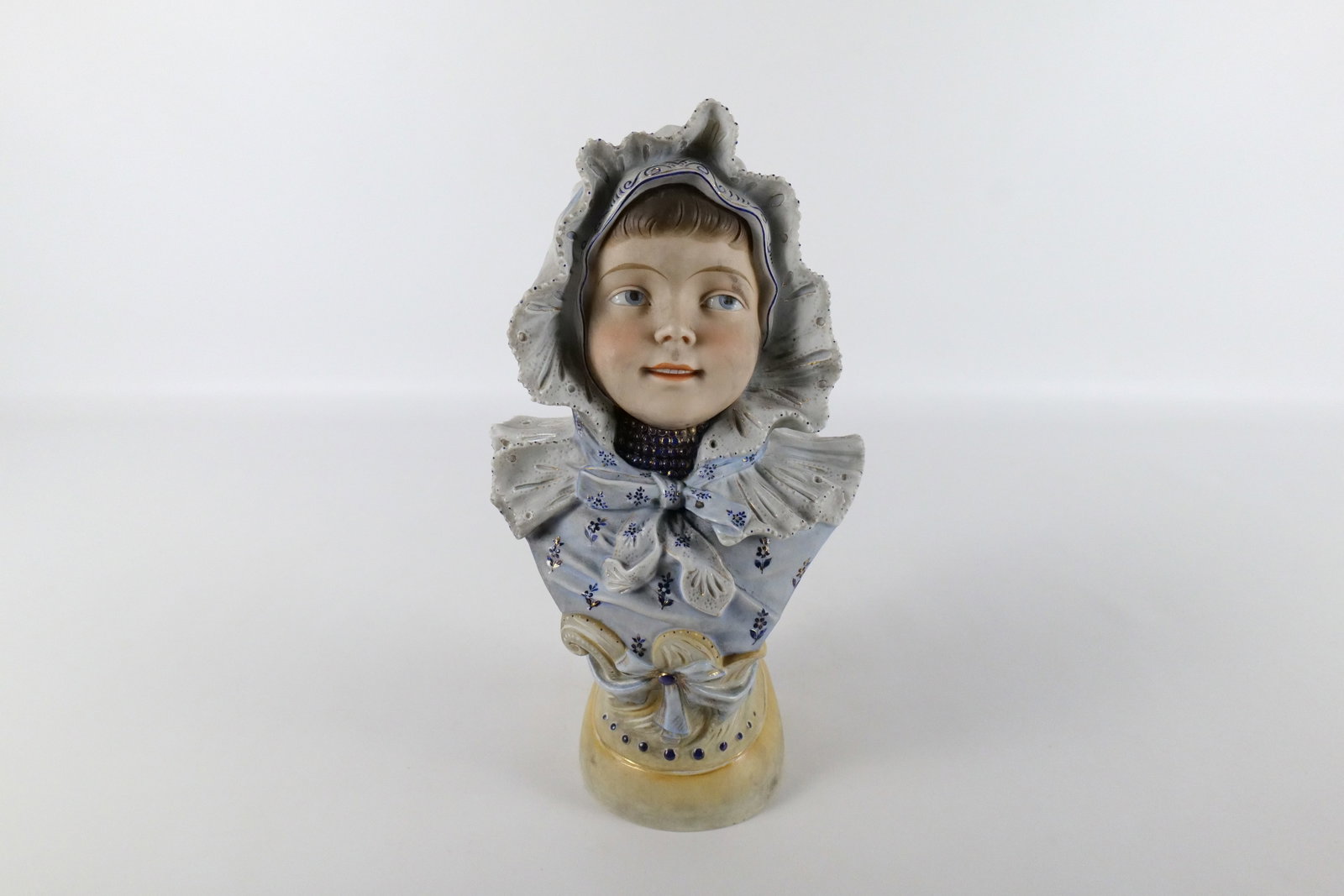 Vintage Bisque Bust of a Girl: Vintage Bisque Bust of a Girl. Some cracking to the inside of the base but overall very good condition. Measures 12" tall x 7" wide. All invoices must be paid within 24 hours of the sale. We offer mul