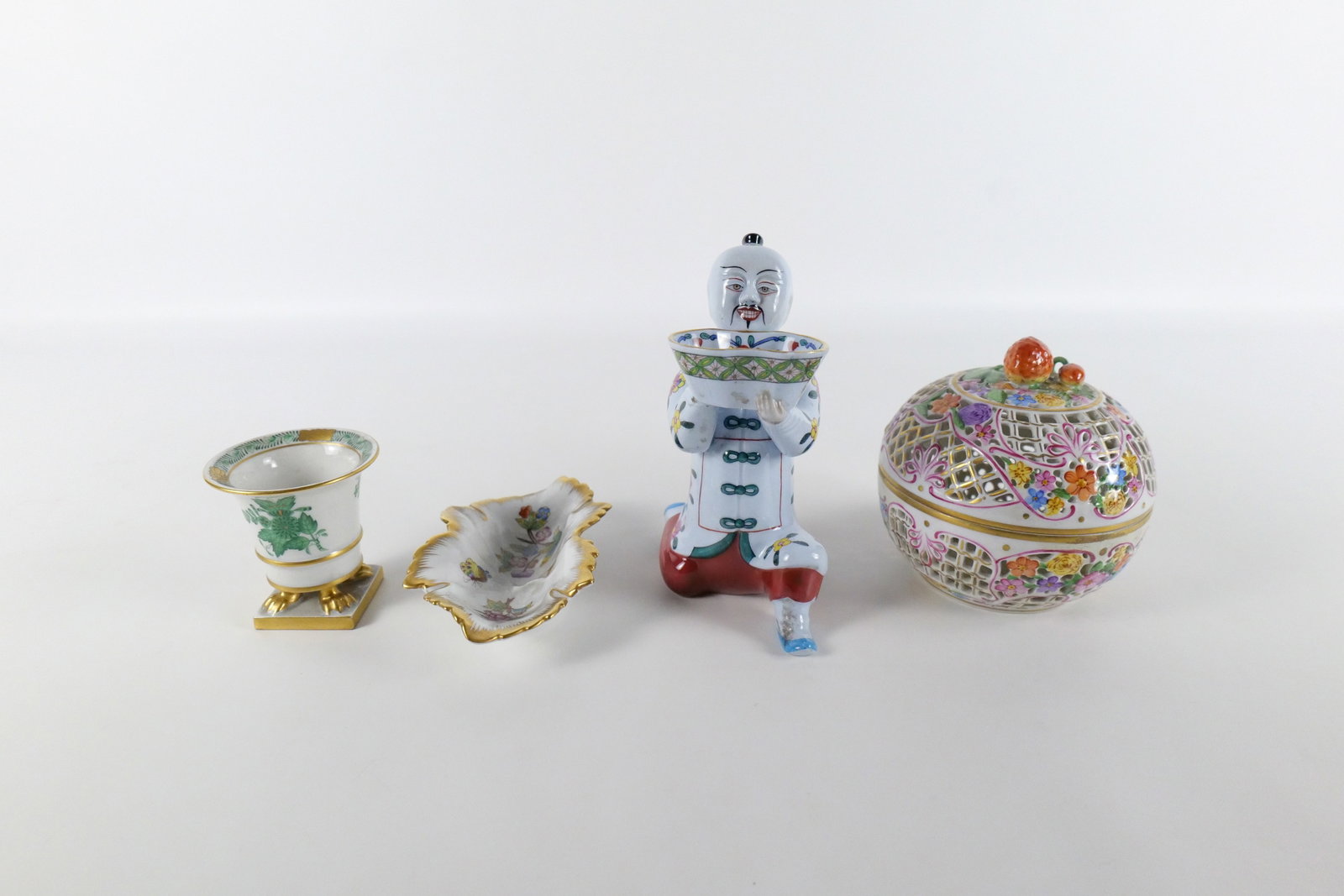 Group Lot of Herend Porcelain Items: Group Lot of Herend Porcelain Items including Chinese Bouquet Toothpick Holder - Hairline Crack, Open Pierce work Potpourri - Stem and Strawberry Missing on Top, Asian Man Holding Bowl - Back Foot Bro
