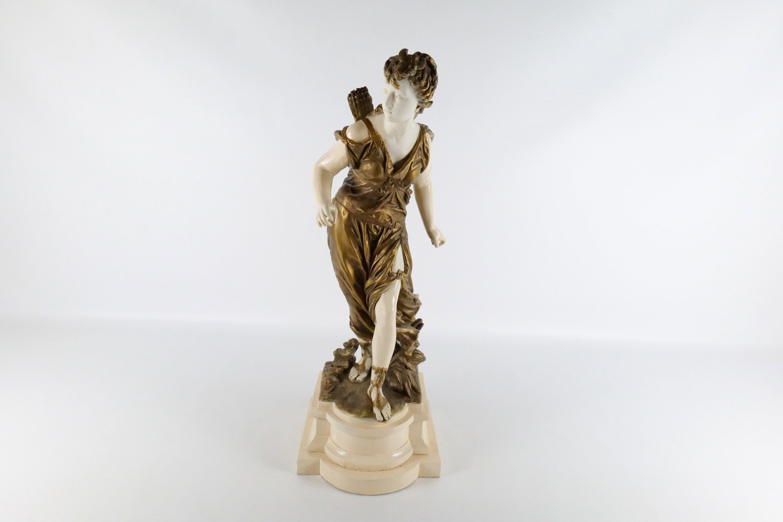 Vintage Chalkware Statue: Vintage Chalkware Statue depicting Woman Walking with Arrows on Back. Left arm has damage. Measures 25" tall x 9" wide. All invoices must be paid within 24 hours of the sale. We offer multiple shippin