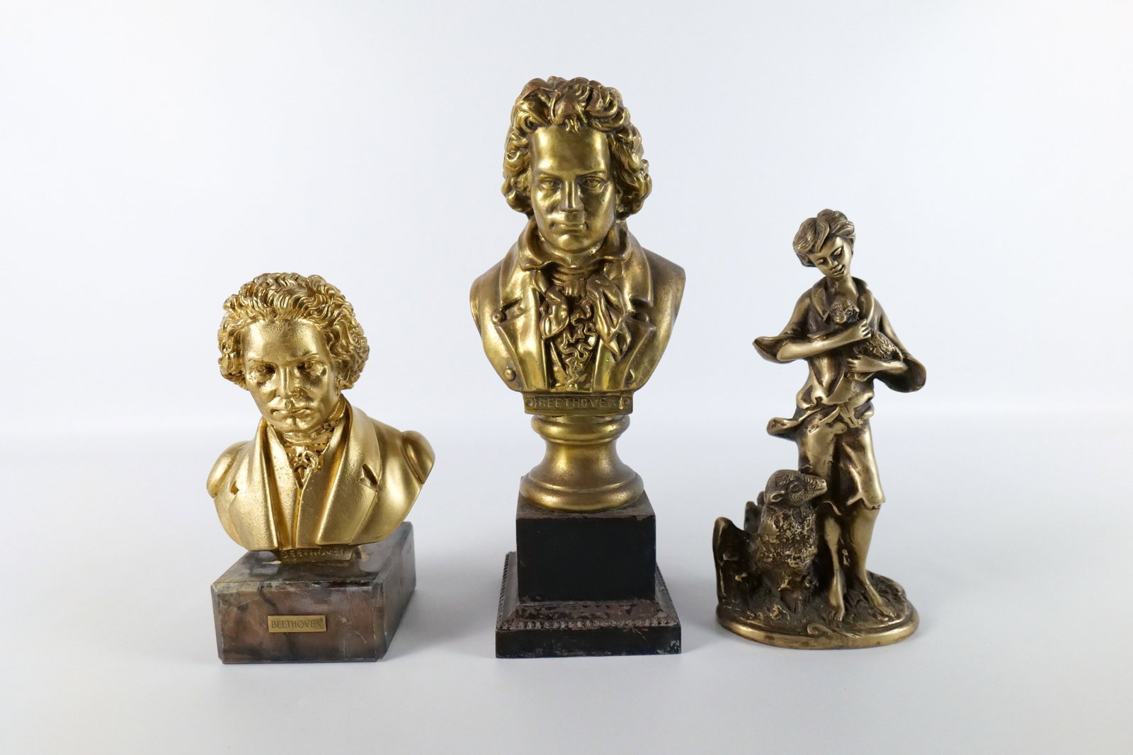 Group Lot of Vintage Statues: Group Lot of Vintage Statues including Mixed Metal Bust of Beethoven on Pedestal Base, Chalkware Bust of Beethoven on Alabaster Base, and Bronze Statue of Shepherd with Sheep. Largest measures 12" tal