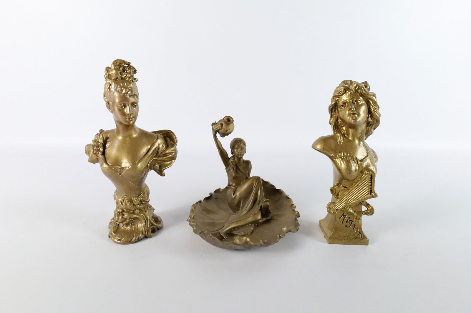 Group Lot of 3 Antique Metalware Woman Figurines: Group Lot of 3 Antique Metalware Woman Figurines including Mixed Metal Bust of Art Nouveau Woman, Mixed Metal Bust of Victorian Woman Marked Mignon, and Bronze Statue of Woman Laying in Lily Pad. All