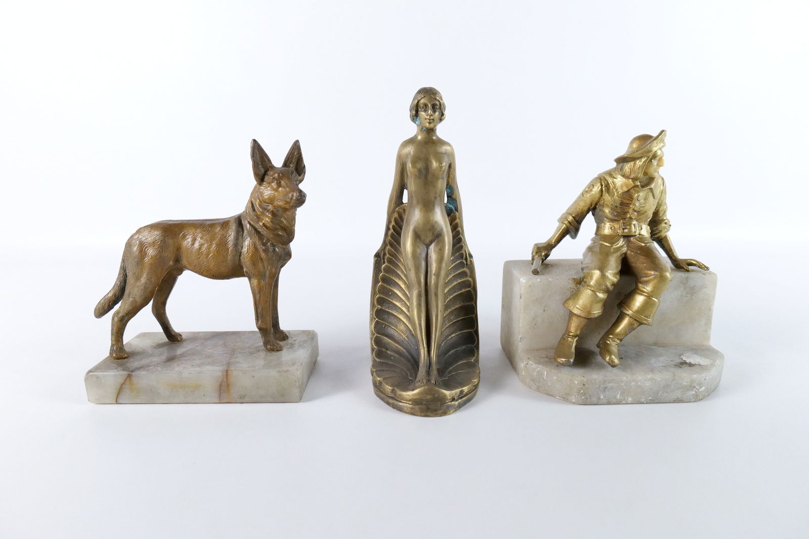 Group Lot of Antique Mixed Metal and Bronze Figurines: Group Lot of Antique Mixed Metal and Bronze Figurines including Mixed Metal German Shepherd on Marble Base, Mixed Metal Pirate Seated on Marble Bench, and Bronze Overlay Art Nouveau Woman Bookend. Lar