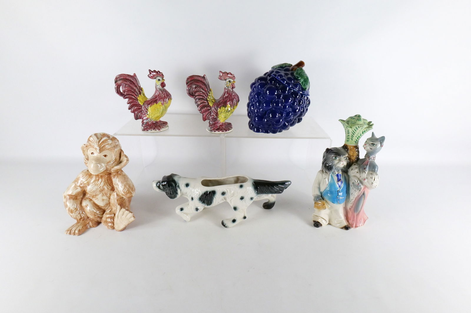 Lot of Ceramic Animal Figures and Cookie Jar: Lot of Ceramic Animal Figures and Cookie Jar. Including Monkey Figure - Made by Susan, Grape Cookie Jar - Repairs and chips on rim of lid, Puppy TV Planter, Decanter with Cats - Missing Lid, Pair of R