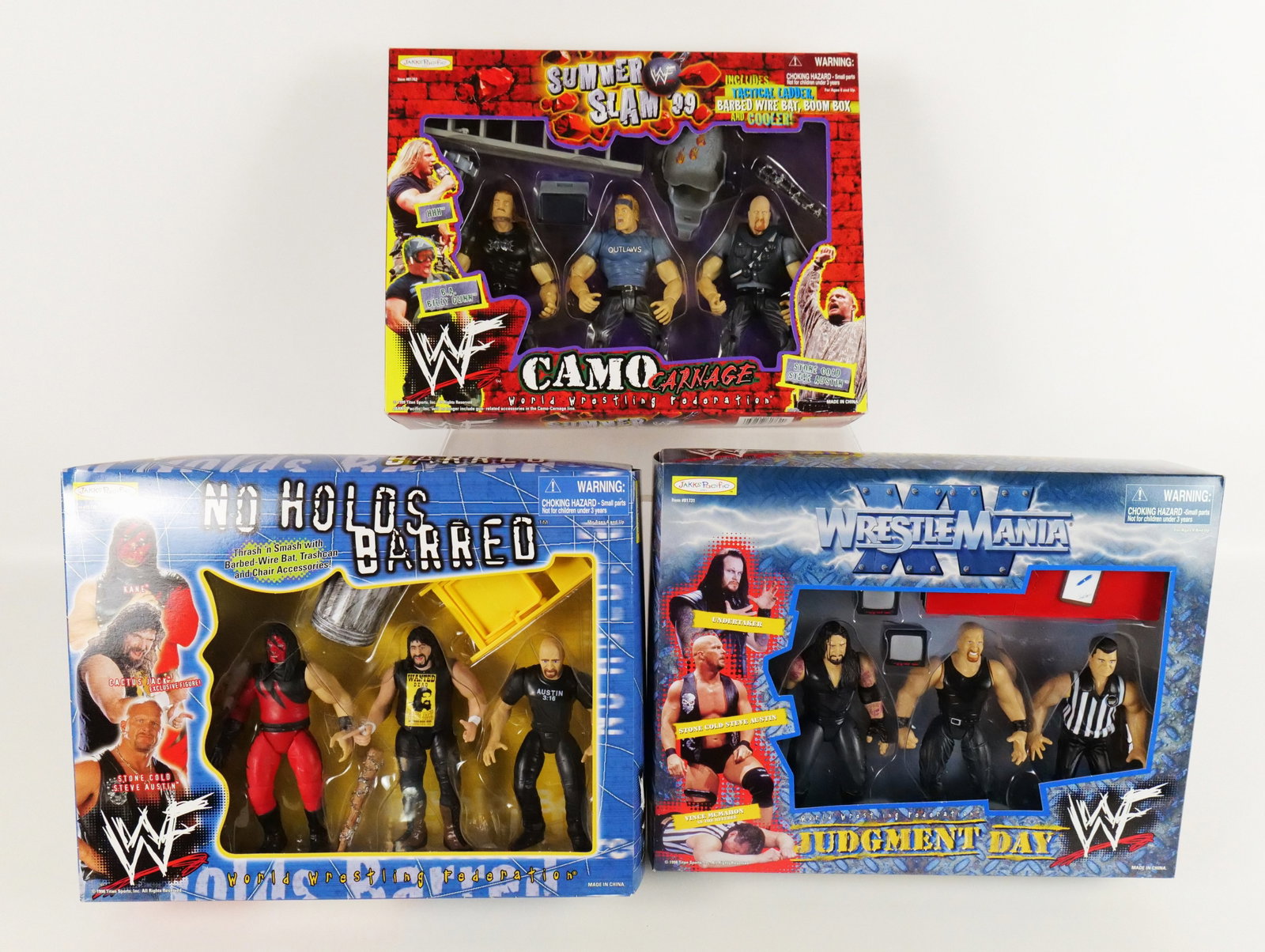 Lot of 3 Jakks Pacific WWF Wrestling Action Figure Sets: Lot of 3 Jakks Pacific WWF Wrestling Action Figure Sets including Summer Slam 99 Camo Carnage (HHH, BA Billy Gunn, & Stone Cold Steve Austin), No Holds Barred (Kane, Cactus Jack Exclusive, & Stone Col
