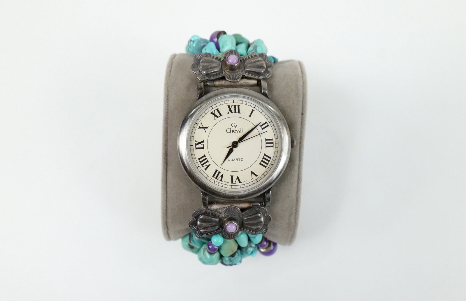Don Lucas South Western Turquoise Watch: Don Lucas South Western Turquoise Watch the lot includes a 8.5'' long ladies watch by Don Lucas featuring a band with 5 rows of turquoise nuggets/chips and amethyst beads with silver bow like accents 