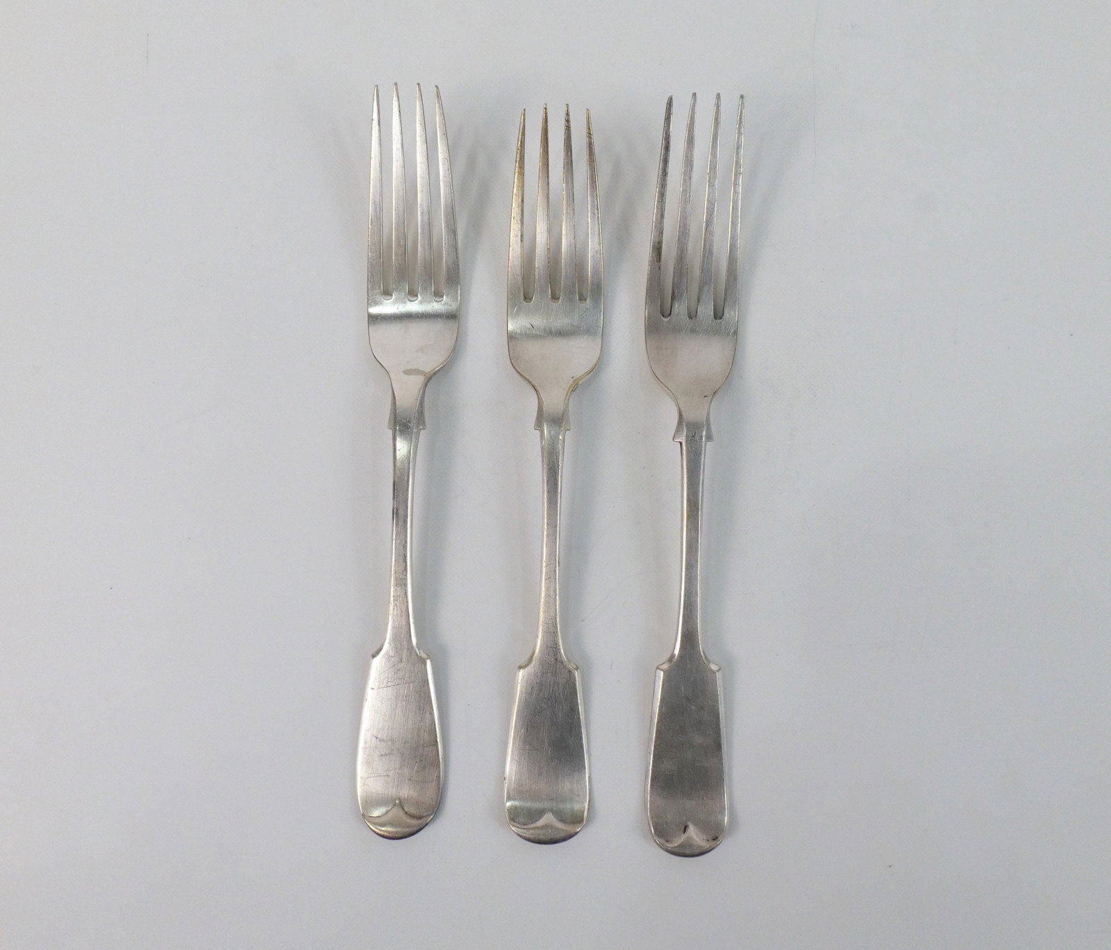 Lot of 19th Century Silver European Hallmarked Dinner Forks: Lot of 3 19th Century Silver European Hallmarked Dinner Forks. Two are monogrammed. All 3 match but all have different hallmarks. Weighs approx. 214.6 grams. Measures 8.5" long x 1" wide. All invoices